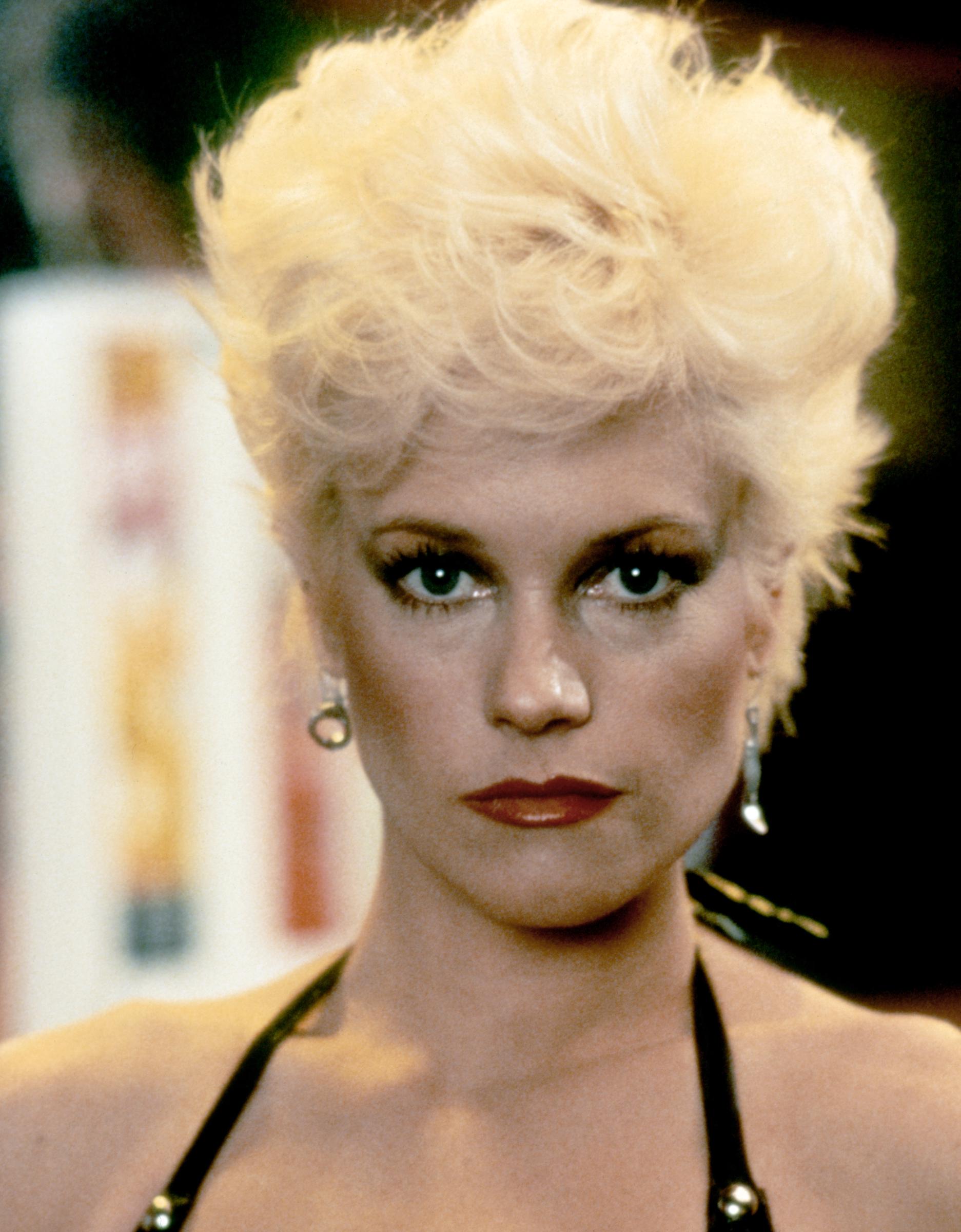 Melanie Griffith appears on the set of Brian De Palma's "Body Double" in 1984, one of the performances that helped establish her as a rising Hollywood star. Years before discussions about cosmetic procedures overshadowed her appearance, the actress was building a career that would eventually include many acclaimed roles.
