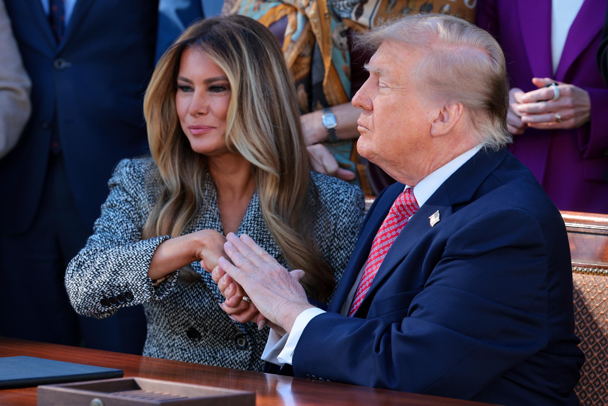 During an October 2026 executive order signing, the couple's gestures prompted mixed interpretations from behavioral experts. Some described their exchange as unusually formal for a married couple. | Source: Getty Images