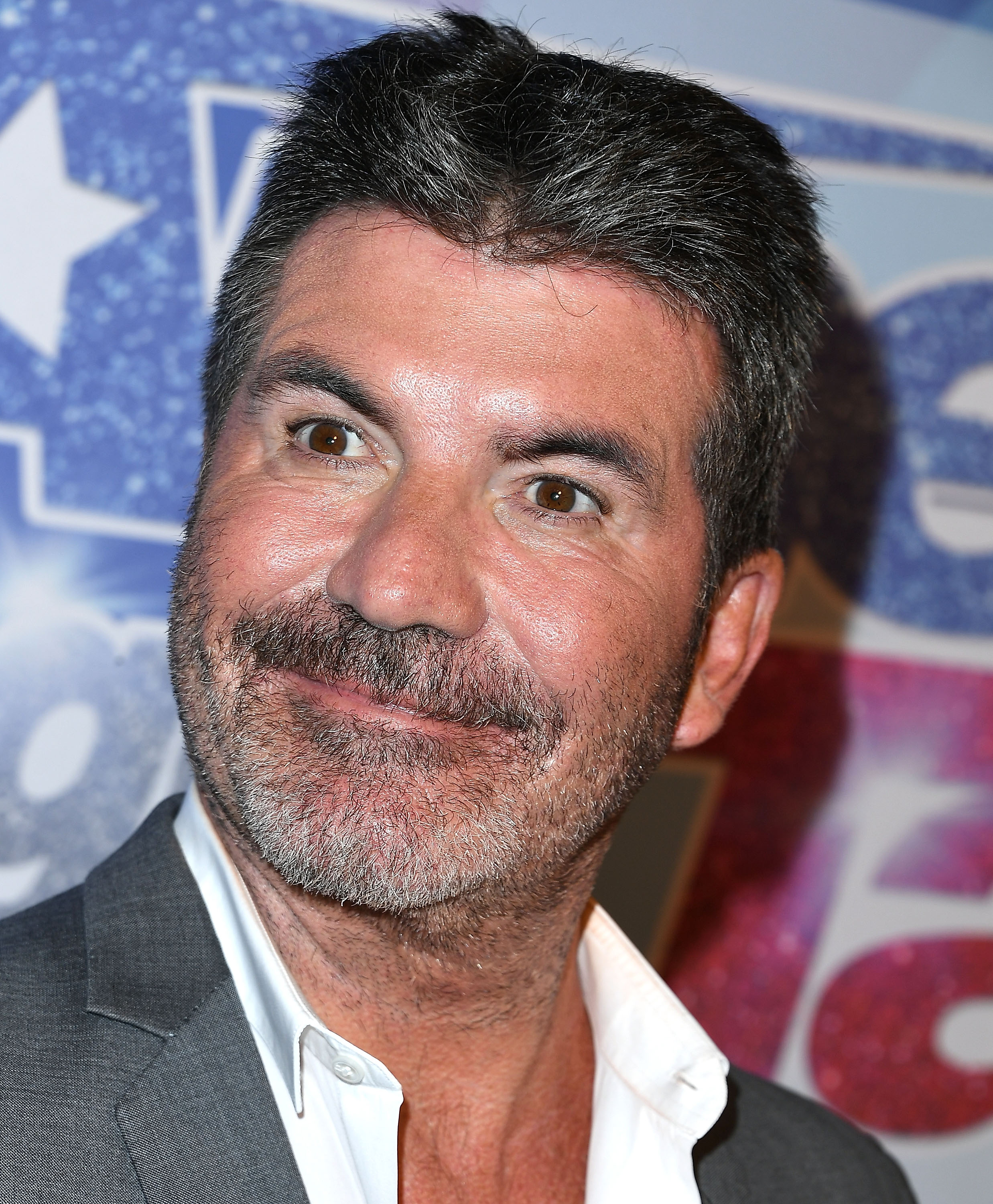 Cowell is pictured in 2017, years before he admitted that he felt he had gone too far with facial filler. He later said an old photo helped make him reconsider his approach to cosmetic treatments.