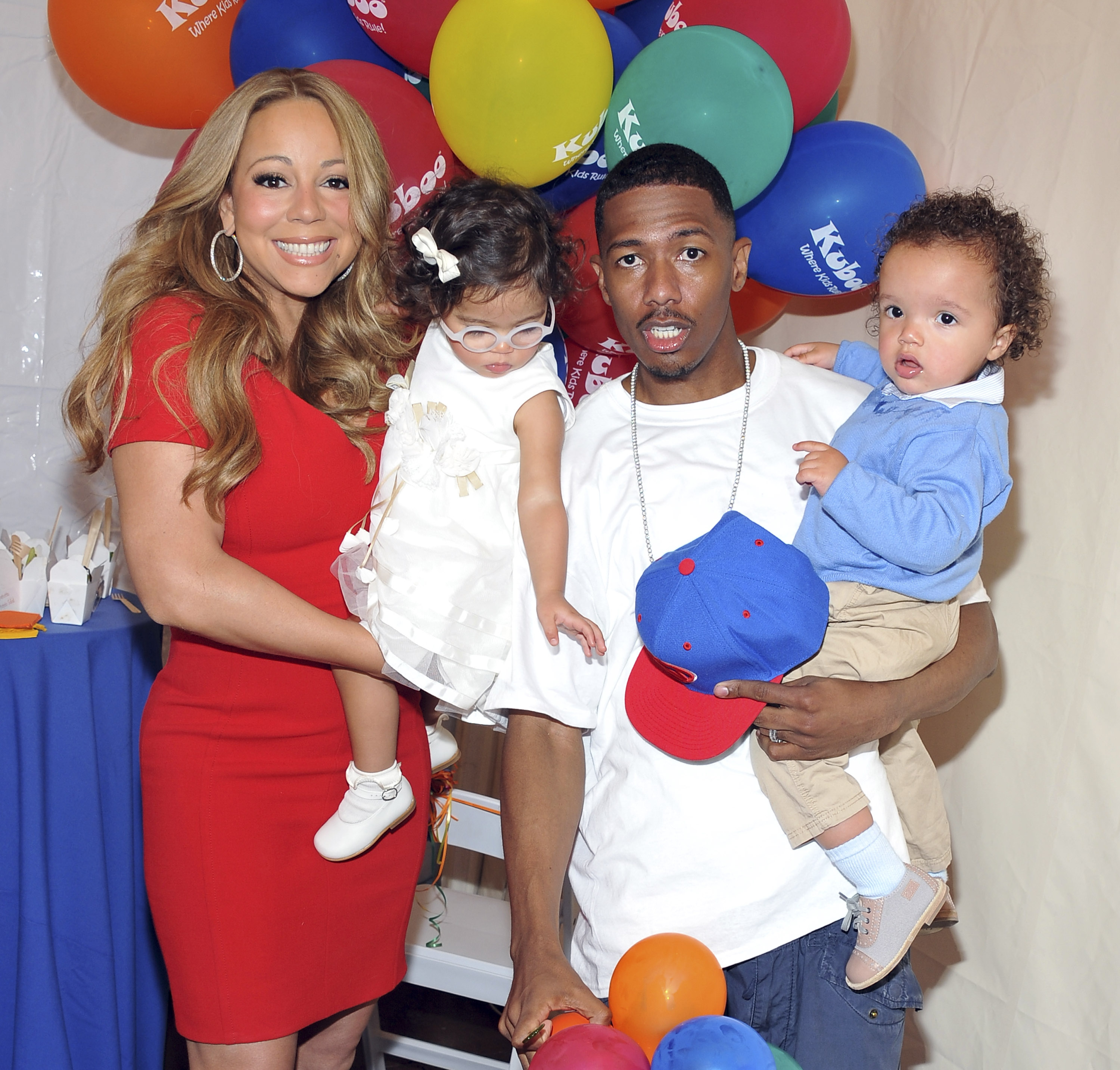 Mariah Carey and her children, Monroe Cannon and Moroccan Scott Cannon, aged 17 months, join host Nick Cannon at the Safe Productions Inc. First Annual Family Day and Kuboo.com Launch at the Santa Monica Pier on October 6, 2012, in California.