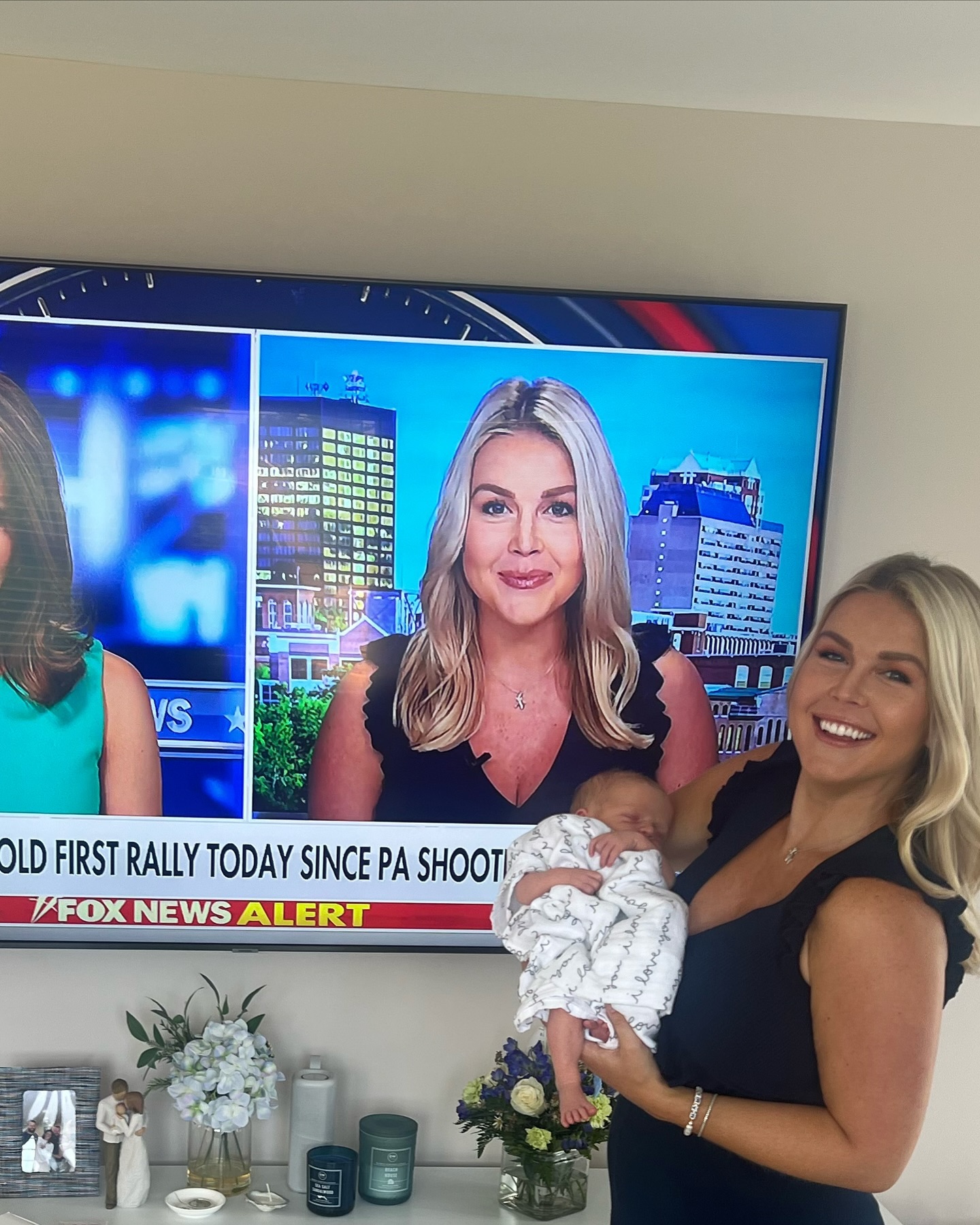 Few images capture Leavitt's overlapping public and private roles quite like this one: she holds her baby while her television persona fills the screen directly behind her. The juxtaposition makes the competing demands she described in her resignation statement especially vivid. | Source: Instagram/karolineleavitt