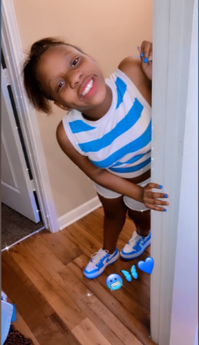 Taylor Hamilton peaks through a door. | Source: GoFundMe