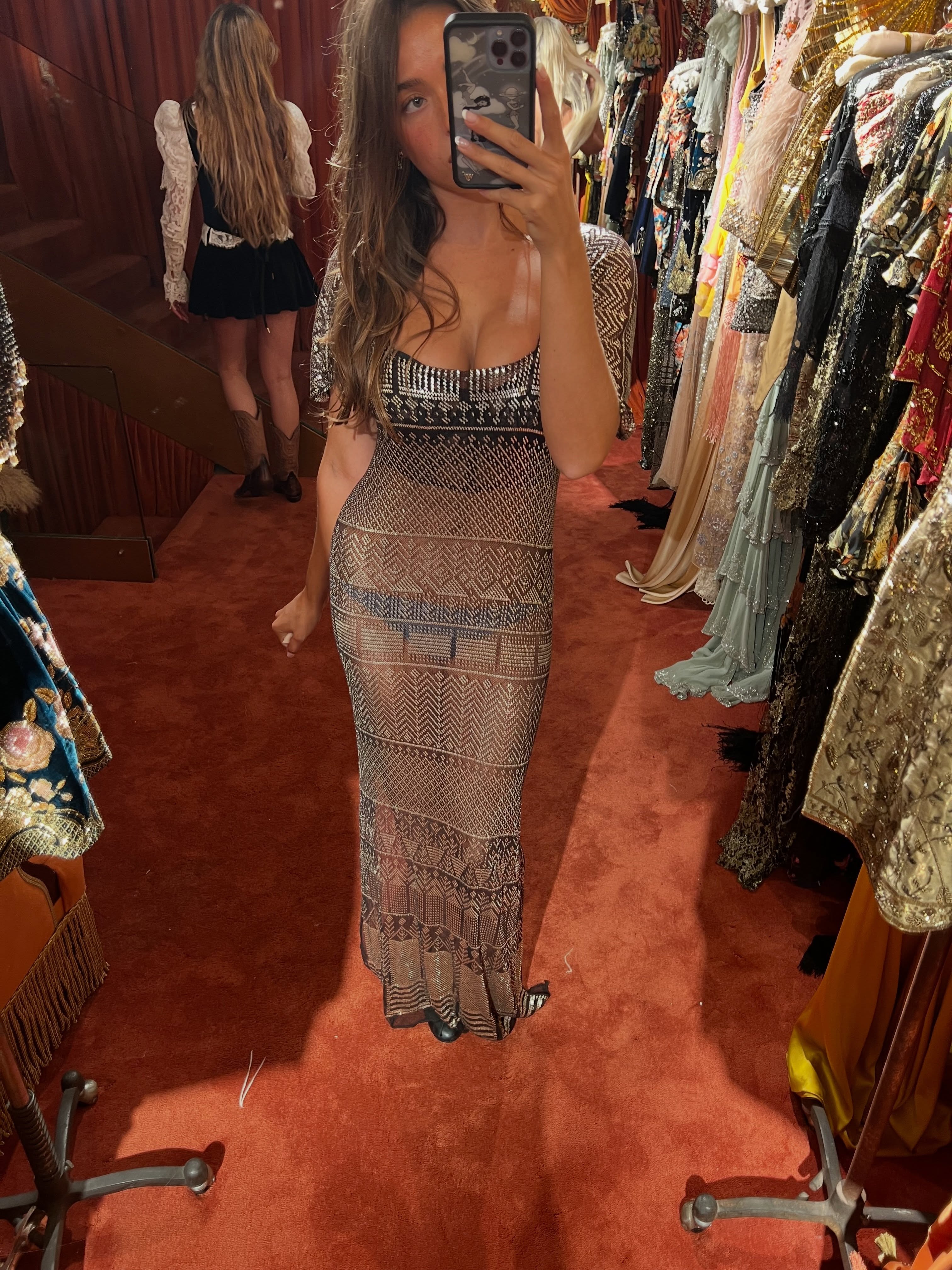 A second photograph from the fitting gave followers an even clearer look at the daringly sheer black fabric and intricate silver detailing of the roughly century-old gown. | Source: Instagram/theyoungestyung