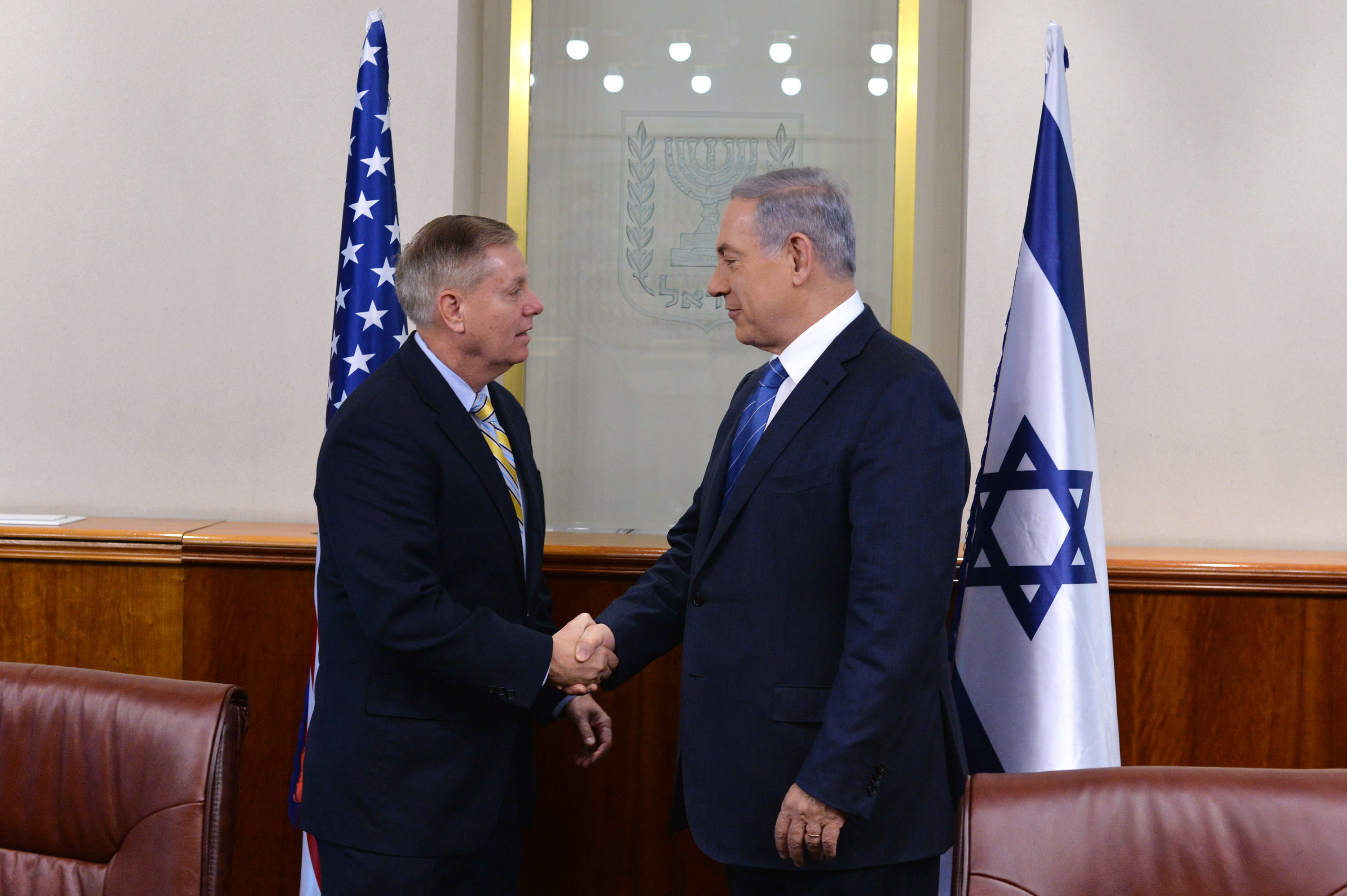 Lindsey Graham shakes hands with Israeli Prime Minister Benjamin Netanyahu during a meeting in Jerusalem, reflecting his longstanding involvement in U.S. foreign policy and America's relationship with key allies in the Middle East. | Source: Getty Images