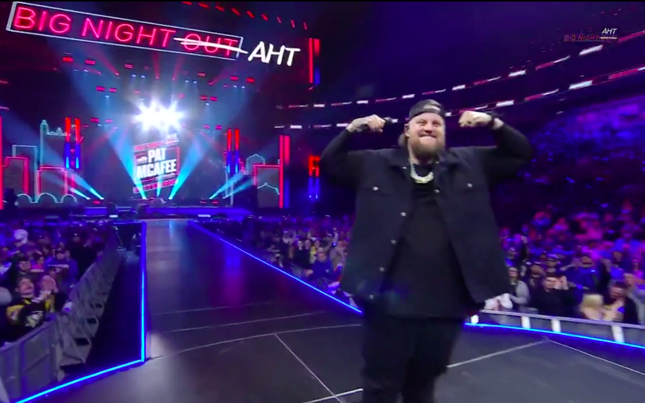 Jelly Roll flexing his arms and showing off his physique during Pat McAfee's "Big Night AHT," posted on April 10, 2025. | Source: X/@PatMcAfeeShow