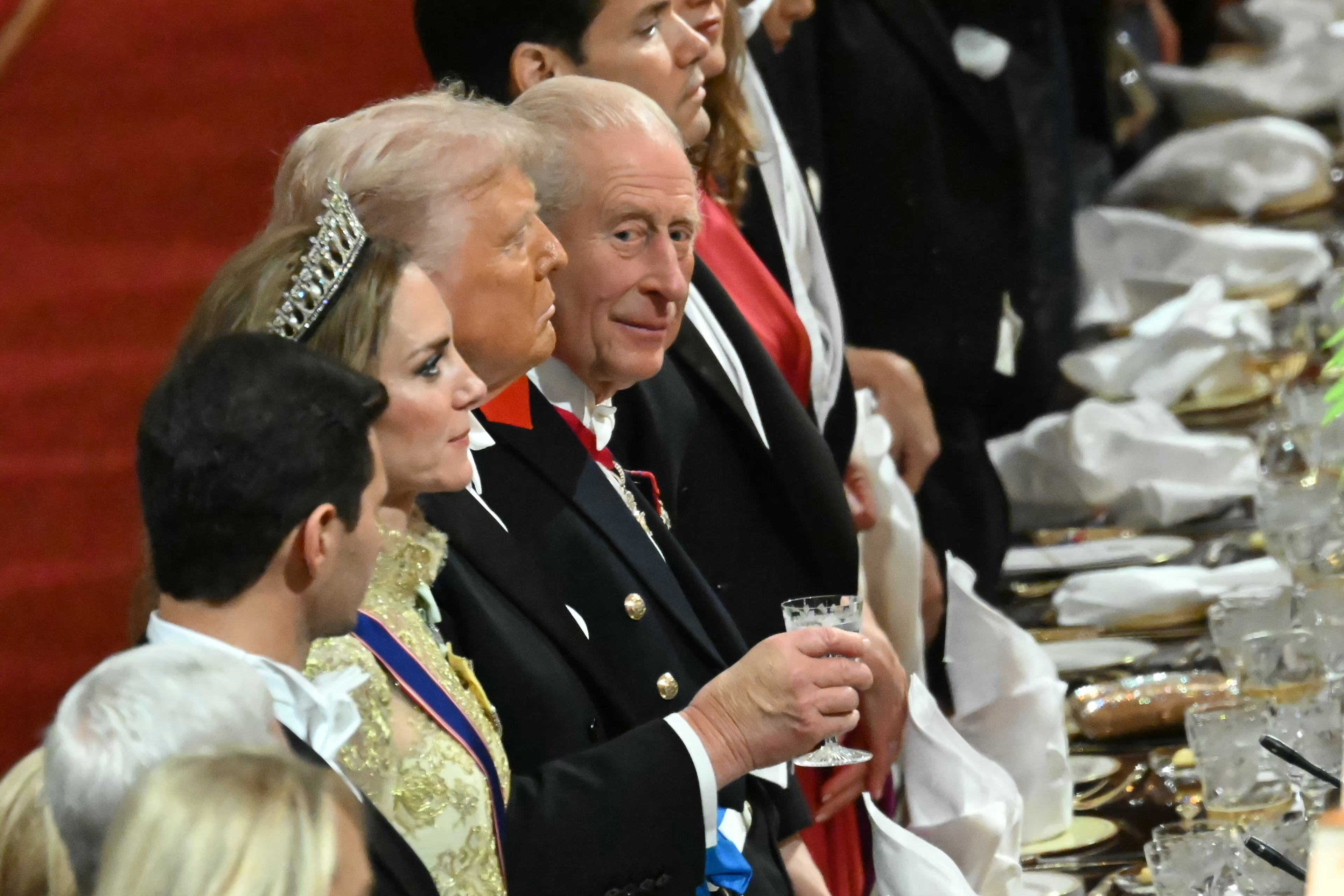 King Charles III glancing while standing beside President Donald Trump and Catherine, Princess of Wales, during a State Banquet at Windsor Castle on September 17, 2025, in England. | Source: Getty Images