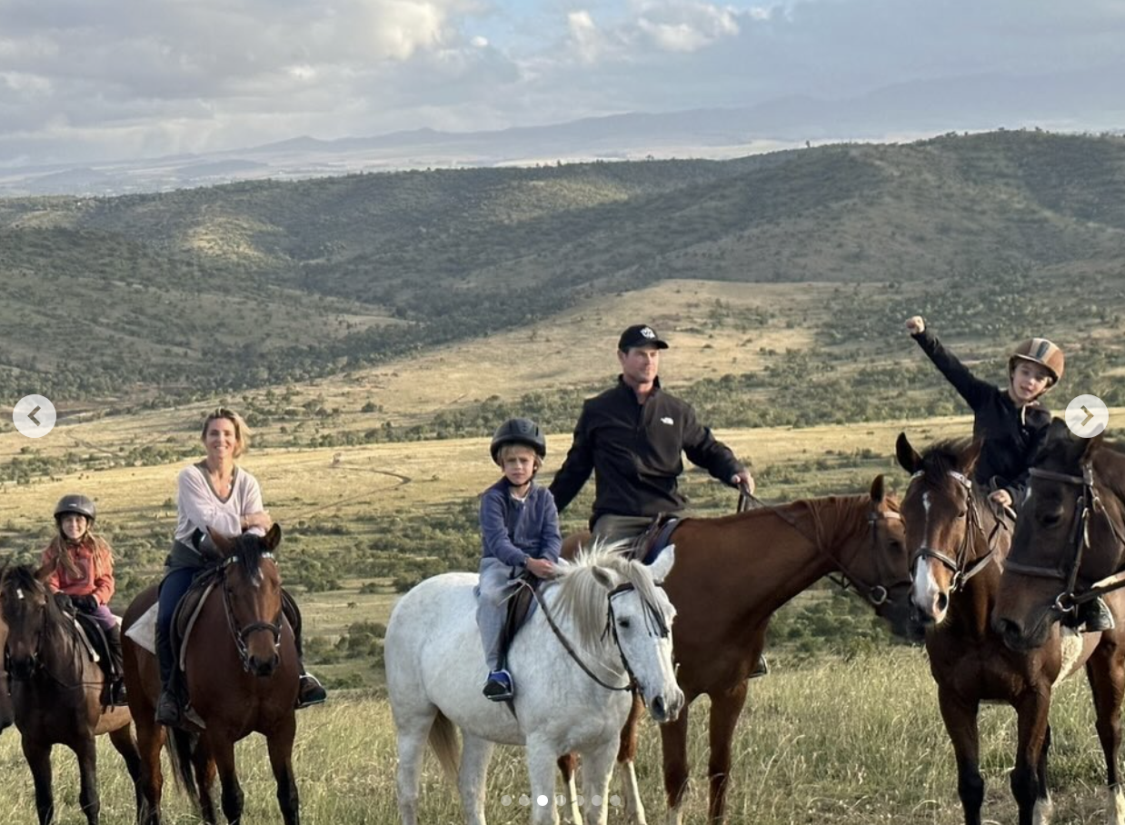 In a photo shared by Elsa Pataky in June 2024 on Instagram, Chris Hemsworth is seen horseback riding with Elsa and their children across a scenic hillside. The family, all wearing helmets and casual gear, posed on horseback with wide open plains and mountains in the background. One of the twins raised a fist in excitement, adding energy to the peaceful moment.