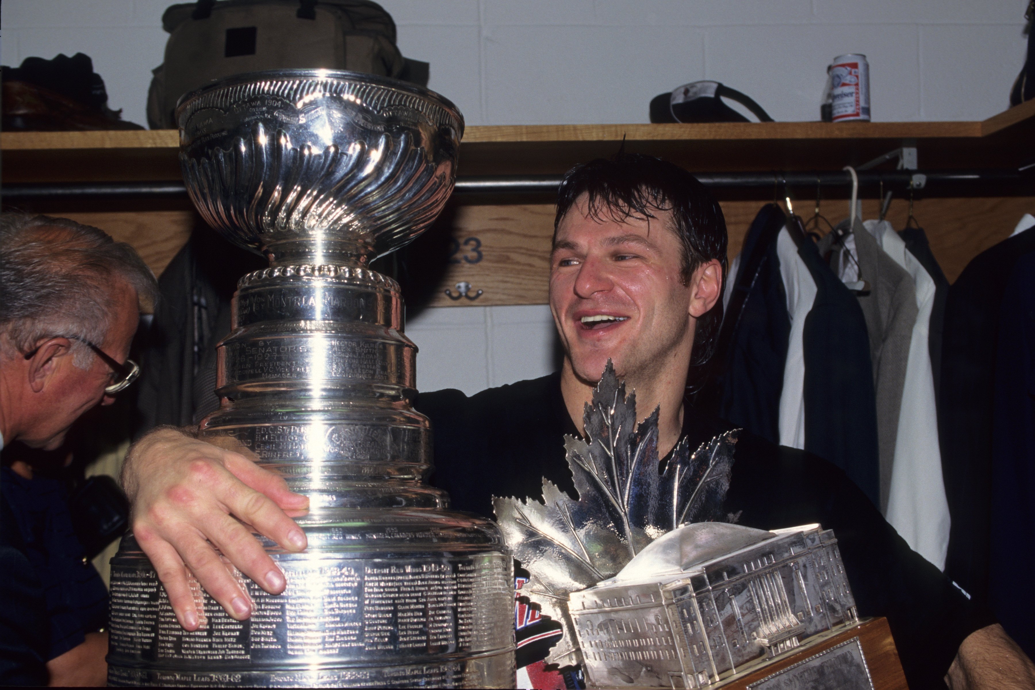 Claude Lemieux #22 of the New Jersey Devils celebrates with the Stanley Cup and the Conn Smythe Trophy after winning 1995 Stanley Cup playoffs against the Detroit Red Wings at Meadowlands Sports Complex on June 24, 1995. | Source: Getty Images