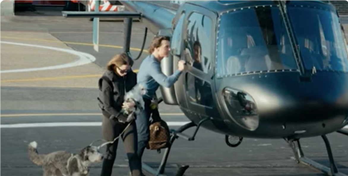 Tom Cruise was photographed as he prepared to board a sleek black helicopter while Ana de Armas, dressed in all black, followed close behind holding two small dogs on leashes. The pair's casual yet coordinated arrival added fuel to fan speculation about their rumored off-screen relationship | Source: YouTube/FTDNews