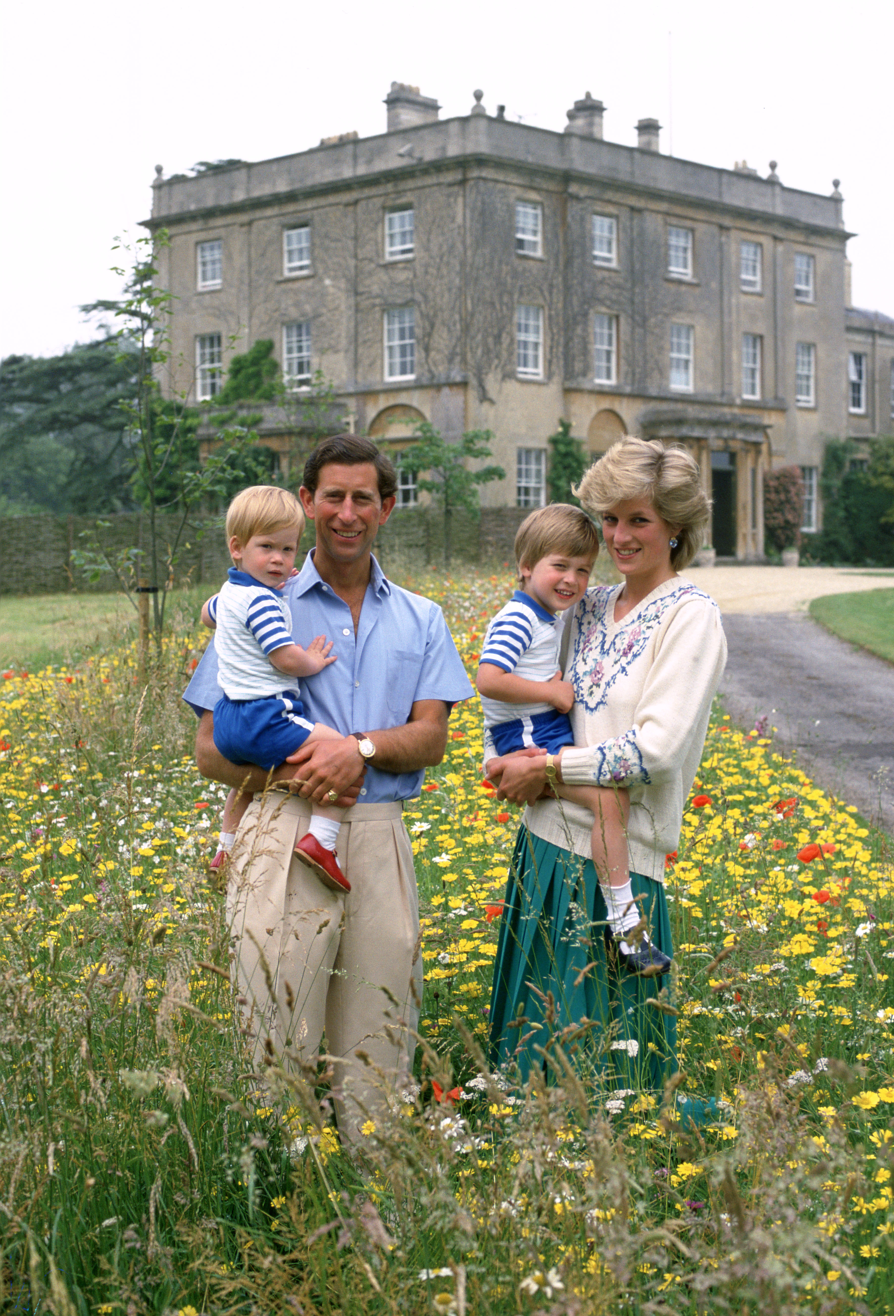 A young Prince Harry is pictured with King Charles III, the late Princess Diana, and Prince William at Highgrove in July 1986. Decades later, Harry's hopes for Archie and Lilibet included giving them a connection to the country and family history he grew up with. | Source: Getty Images