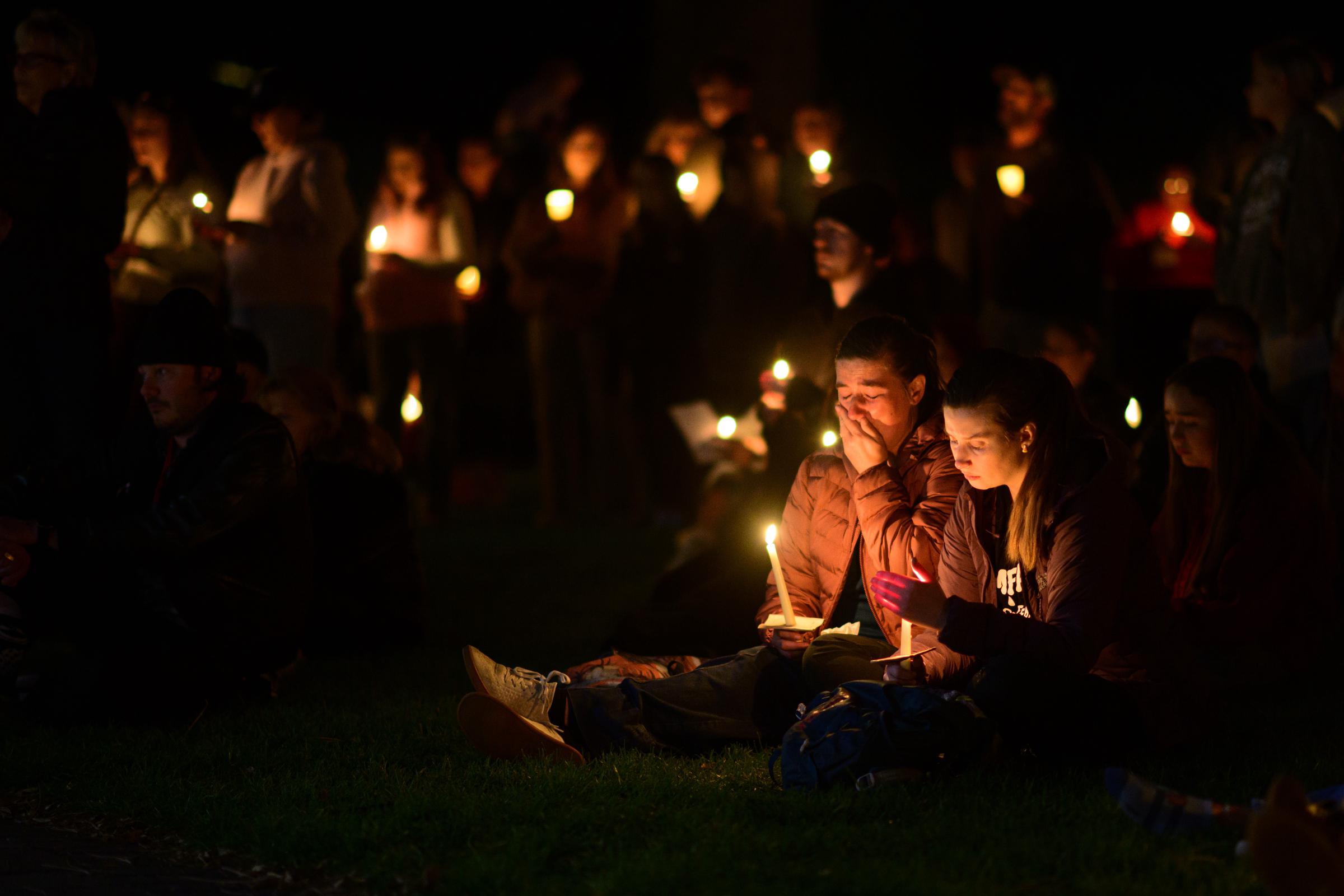 Mourners hold candles during a nighttime vigil in Bend following the deadly shooting at Silver Rail Elementary School. | Source: Getty Images