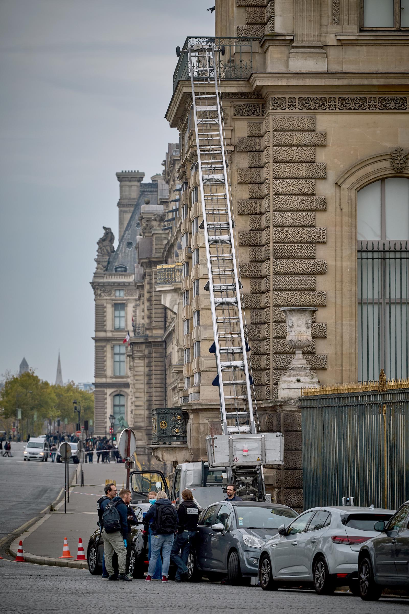 Police and and other officers secure a furniture elevator extended to the balcony of a gallery at the Louvre on October 19, 2025, in Paris, France. | Source: Getty Images