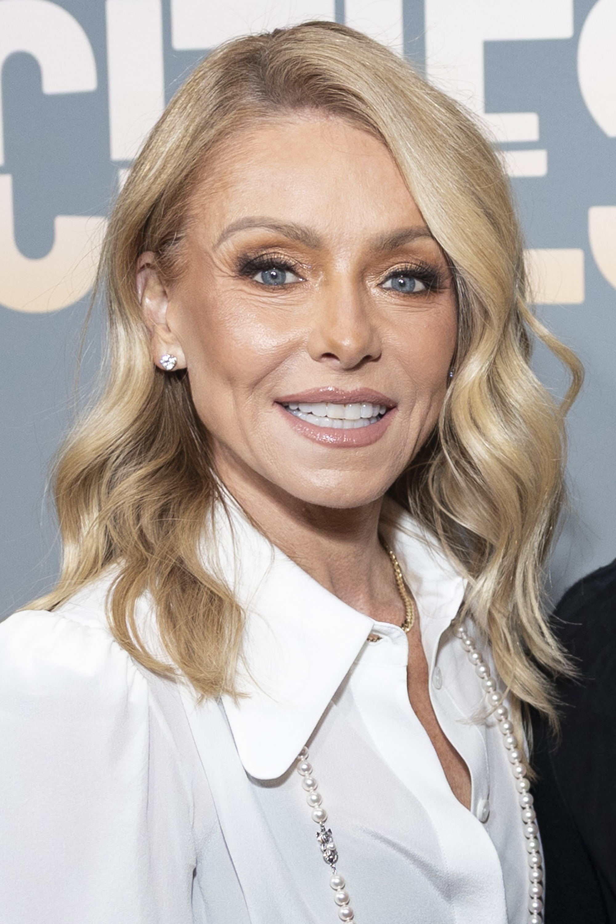 Kelly Ripa has maintained her signature blonde hair throughout decades on television, but even regular coloring hasn't stopped stubborn gray roots from reappearing sooner than expected. | Source: Getty Images
