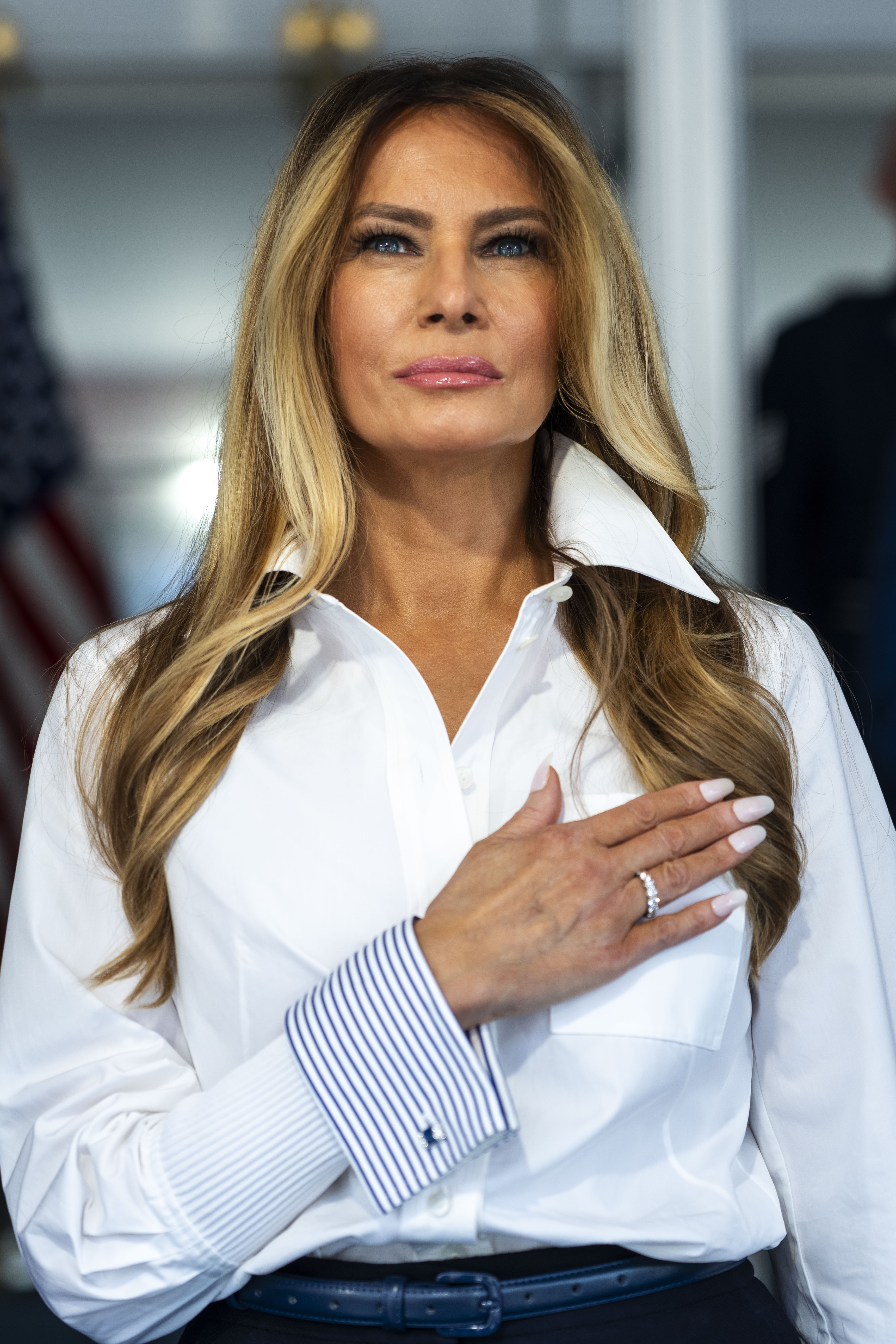 Netizens focused heavily on the first lady's manicure. In this photo, Melania Trump stood during the National Anthem at the start of the NTT INDYCAR Series Freedom 250 on August 23, 2026, in Washington, D.C. | Source: Getty Images