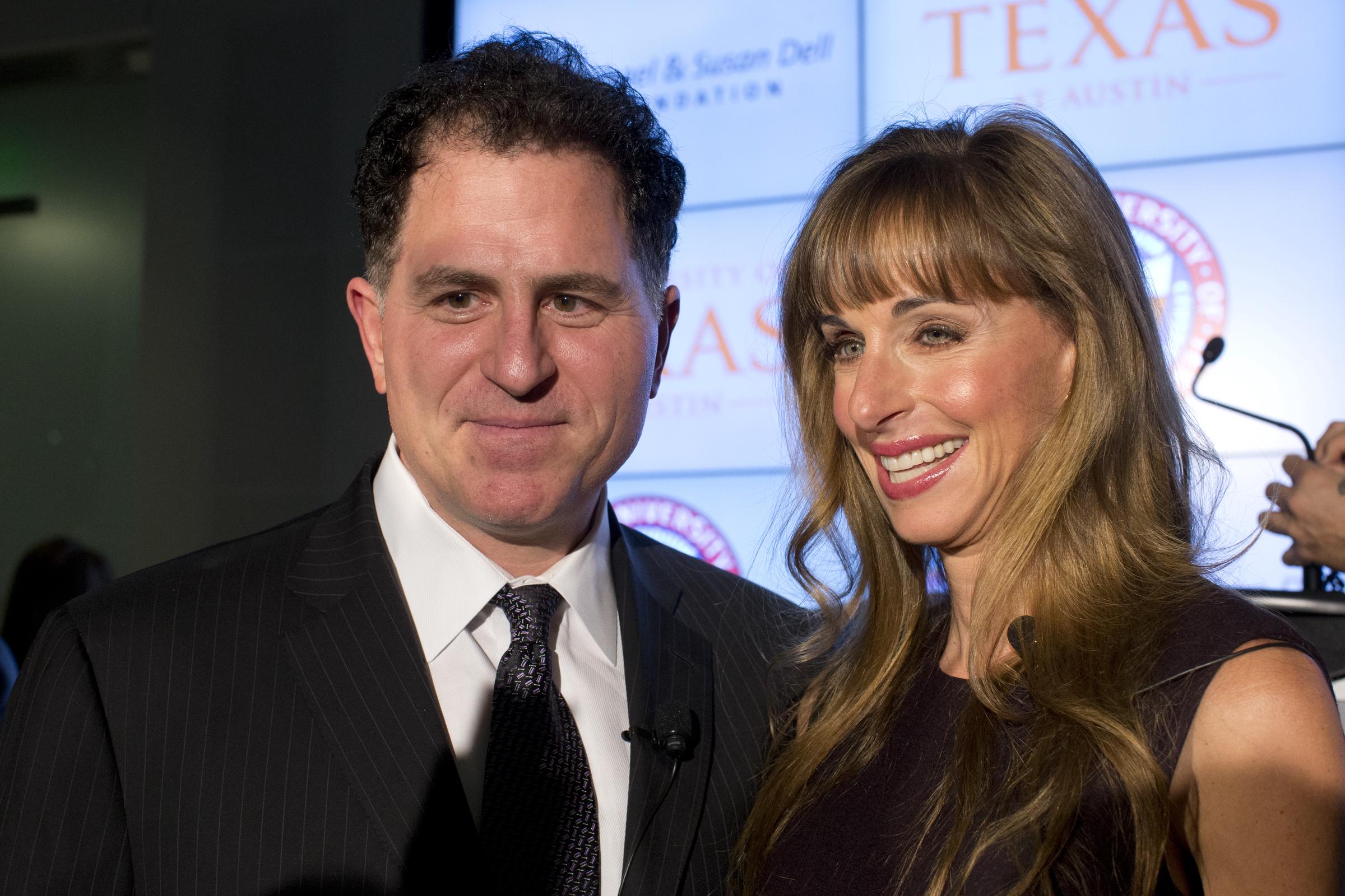 Susan Dell stands beside Michael Dell during the announcement of their $50 million, 10-year donation to the University of Texas at Austin for a new Dell Medical School. The couple appeared together onstage as the initiative was unveiled.
