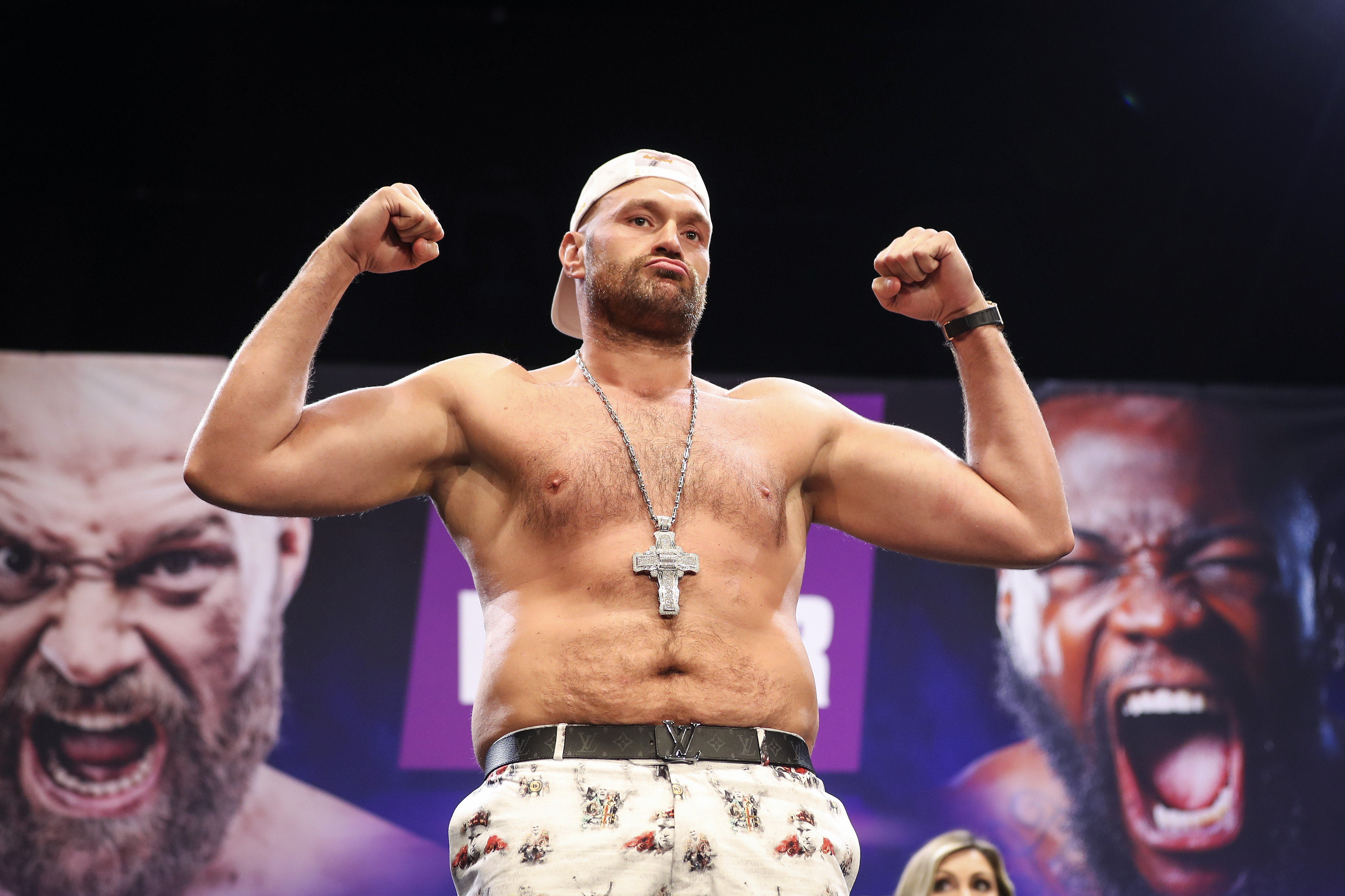 Tyson Fury flexed for cameras during a press conference at The Novo by Microsoft at L.A. Live in Los Angeles, California, on June 15, 2021. More than a year had passed since Fury stopped Deontay Wilder in their rematch to reclaim heavyweight championship glory, completing a comeback that had once appeared improbable. He was now preparing to face Wilder for a third time as their rivalry continued.