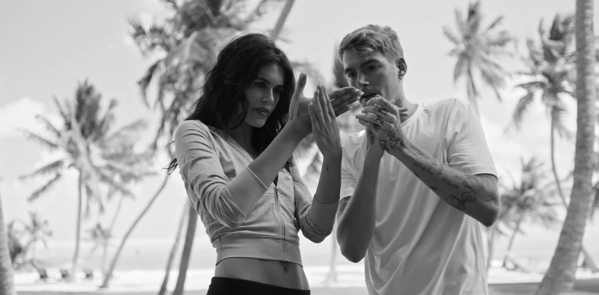 Kaia Gerber and her brother Presley Gerber appear together in a black-and-white image from their Vuori family campaign, photographed against a coastal California backdrop. | Source: Instagram/presleygerber