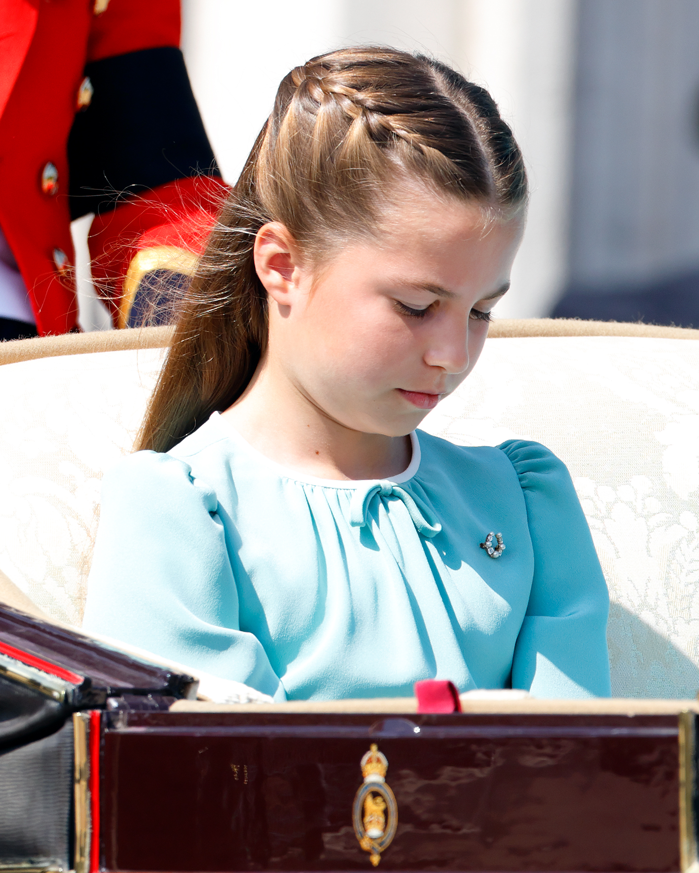 Princess Charlotte of Wales departs Buckingham Palace in a horse-drawn carriage during Trooping The Colour 2025.