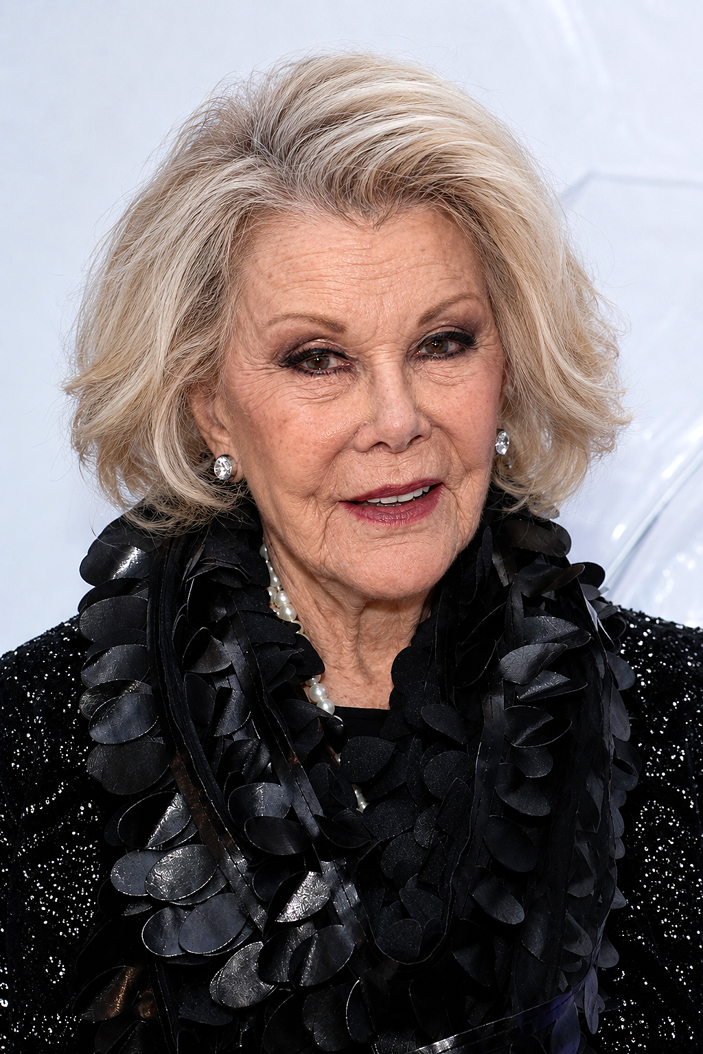 In this AI-generated portrait, Joan is shown with deeper lines across her forehead and around her eyes and mouth, paired with voluminous blonde-gray hair. | Source: ChatGPT
