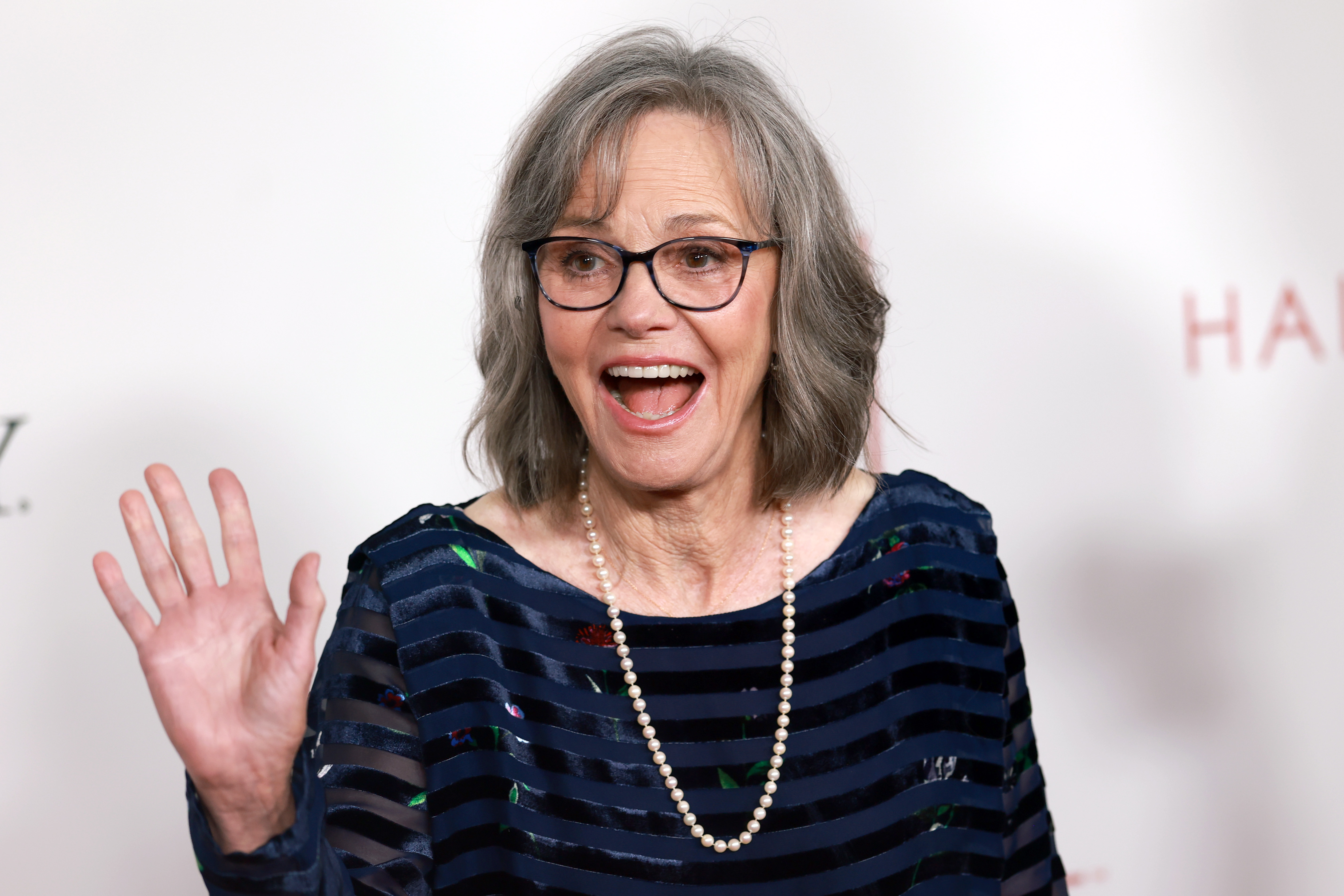 Sally Field embraces the beauty of her 70s, appearing ageless with a warm smile as she waves at the Television Academy's 27th Annual Hall of Fame Ceremony at JW Marriott LA Live in Los Angeles, California.
