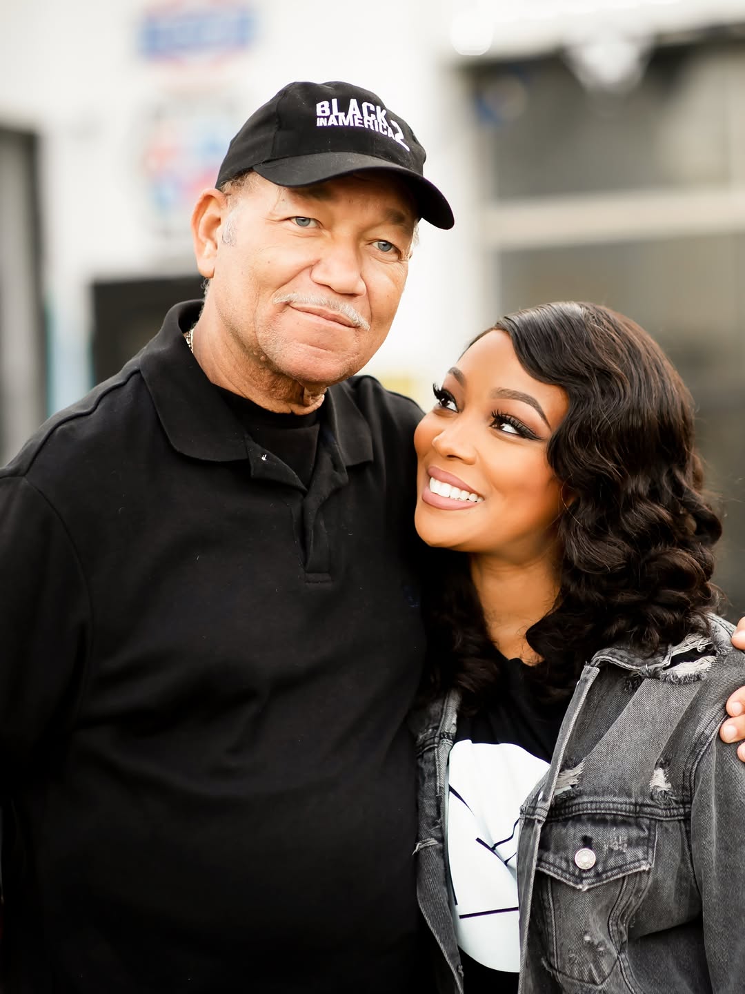 Monica looks at her late dad with love and a smile as M.C. Arnold Jr. smiles for the camera. | Source: Instagram/monicadenise