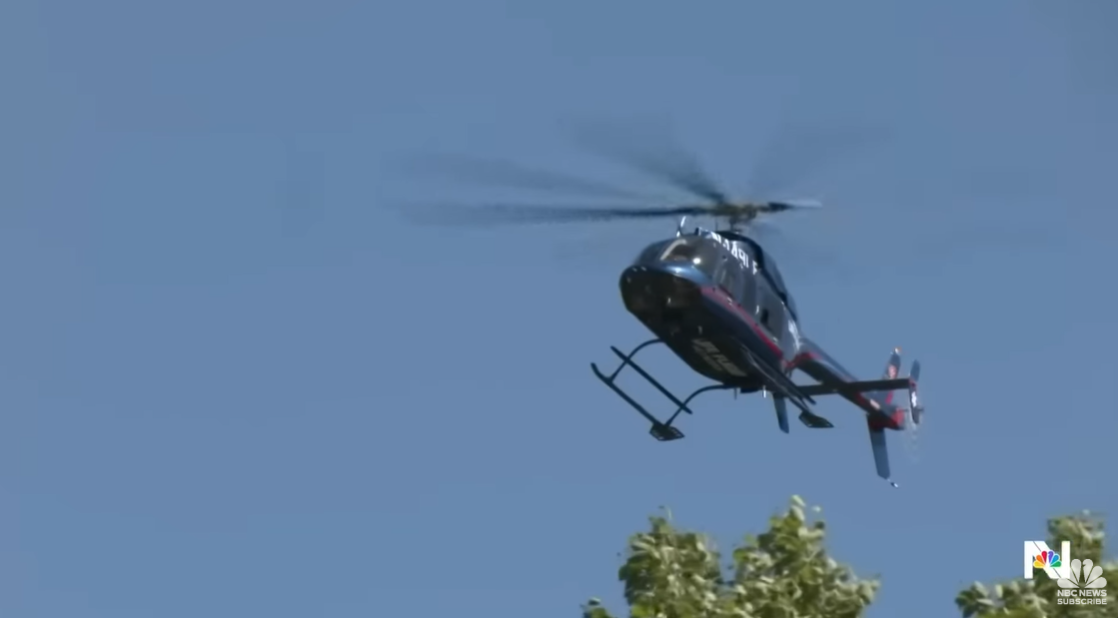 A law enforcement helicopter searches the area above Canfield Mountain during the active shooter response, posted on June 29, 2025 | Source: YouTube/NBCNews