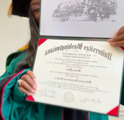A close-up of Simone Biles holding her honorary degree. | Source: TikTok/@simonebilesowens