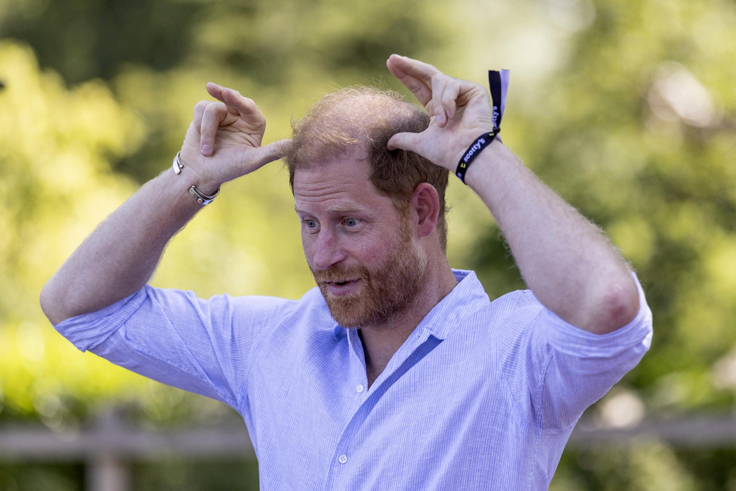 There were still some misunderstandings regarding the Sussexes' protection during their travels. In this photo, Prince Harry is seen reacting as he took part in a goat yoga class during Scotty's Summer Festival at Maxstoke Castle near Birmingham, England, on July 11, 2026. | Source: Getty Images