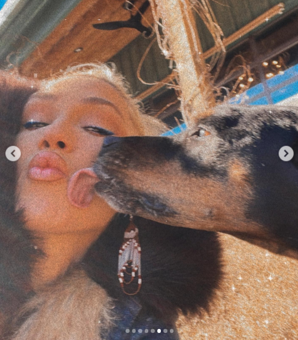 This is a photo of Gwen Stefani and Betty, licking her face, posted on January 16, 2022. | Source: Instagram/gwenstefani