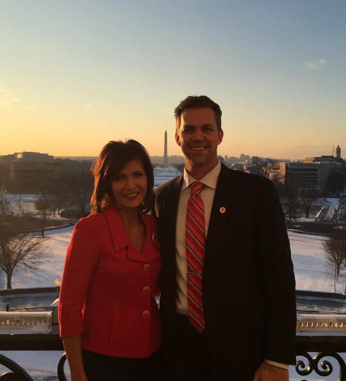 With a wintery cityscape behind them, Kristi and Bryon pose closely — formal, composed, and grounded in a shared presence that carries through the frame. | Source: Instagram/sdbryonnoem