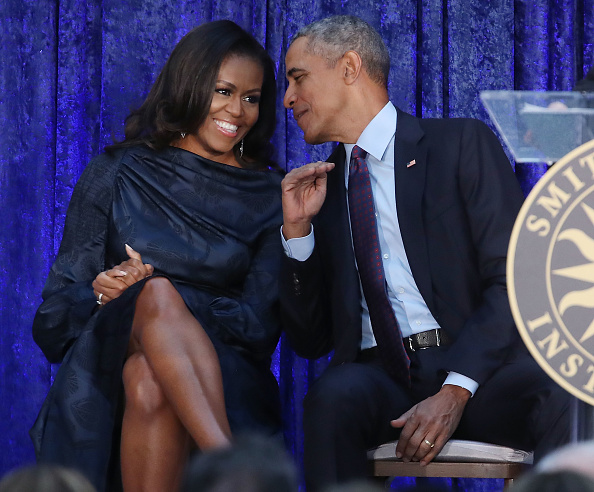 Barack and Michelle Obama share a tender moment during their White House years, a period that marked the beginning of the 13-year chapter remembered in their emotional family announcement. | Source: Getty Images