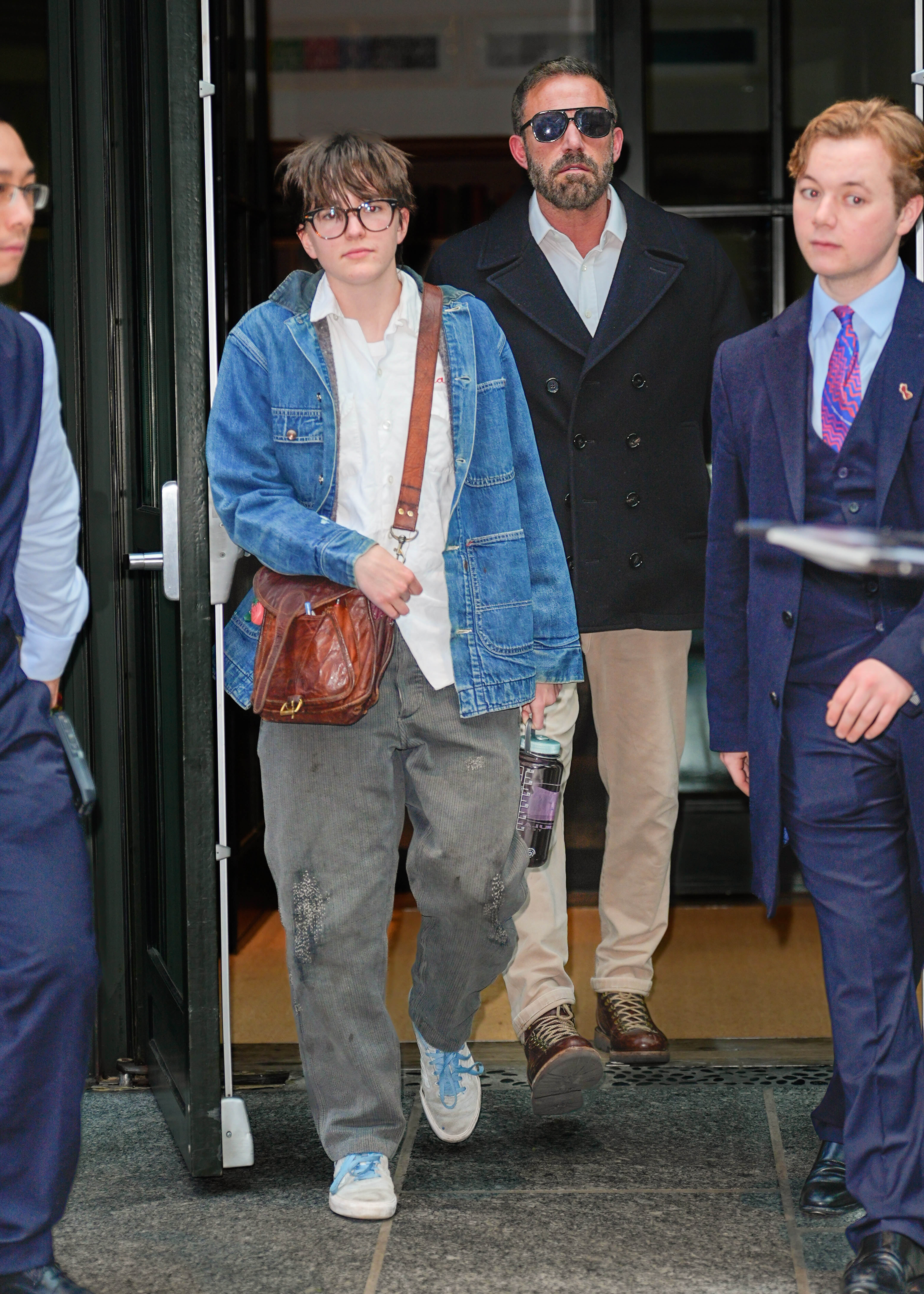 Ben Affleck walks behind one of his children in New York City. The actor has said he and Jennifer Garner want their children to have the freedom to decide their own futures rather than feel pressured to follow their parents into Hollywood. | Source: Getty Images