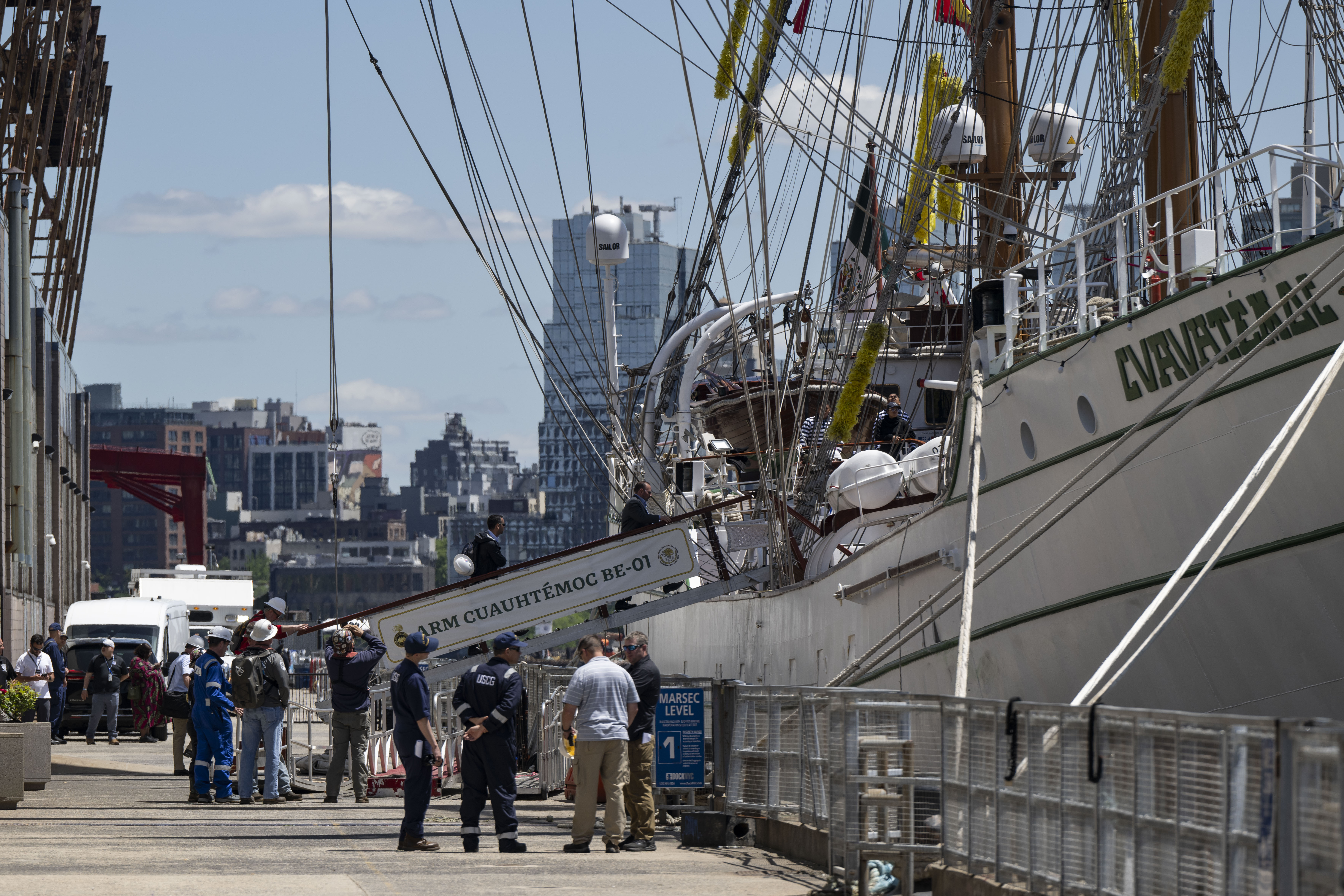 People walk aboard the damaged Mexican Navy sailing ship, the Cuauhtémoc, after it crashed into the Brooklyn Bridge over the weekend in New York City, on May 20, 2025 | Source: Getty Images