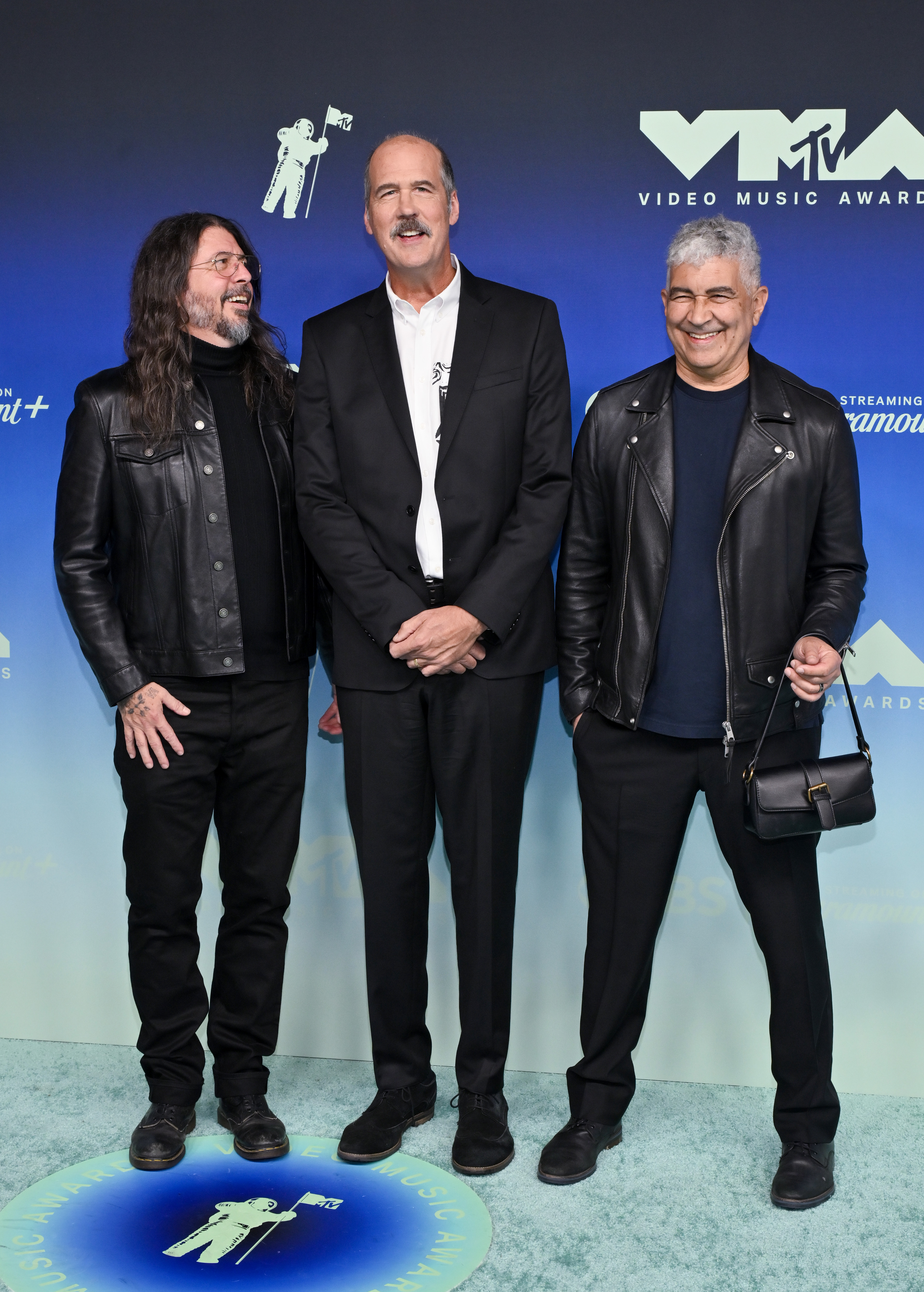 Dave Grohl, Krist Novoselic, and Pat Smear pose together at the 2026 MTV Video Music Awards ahead of accepting Nirvana's Video Vanguard Award. | Source: Getty Images
