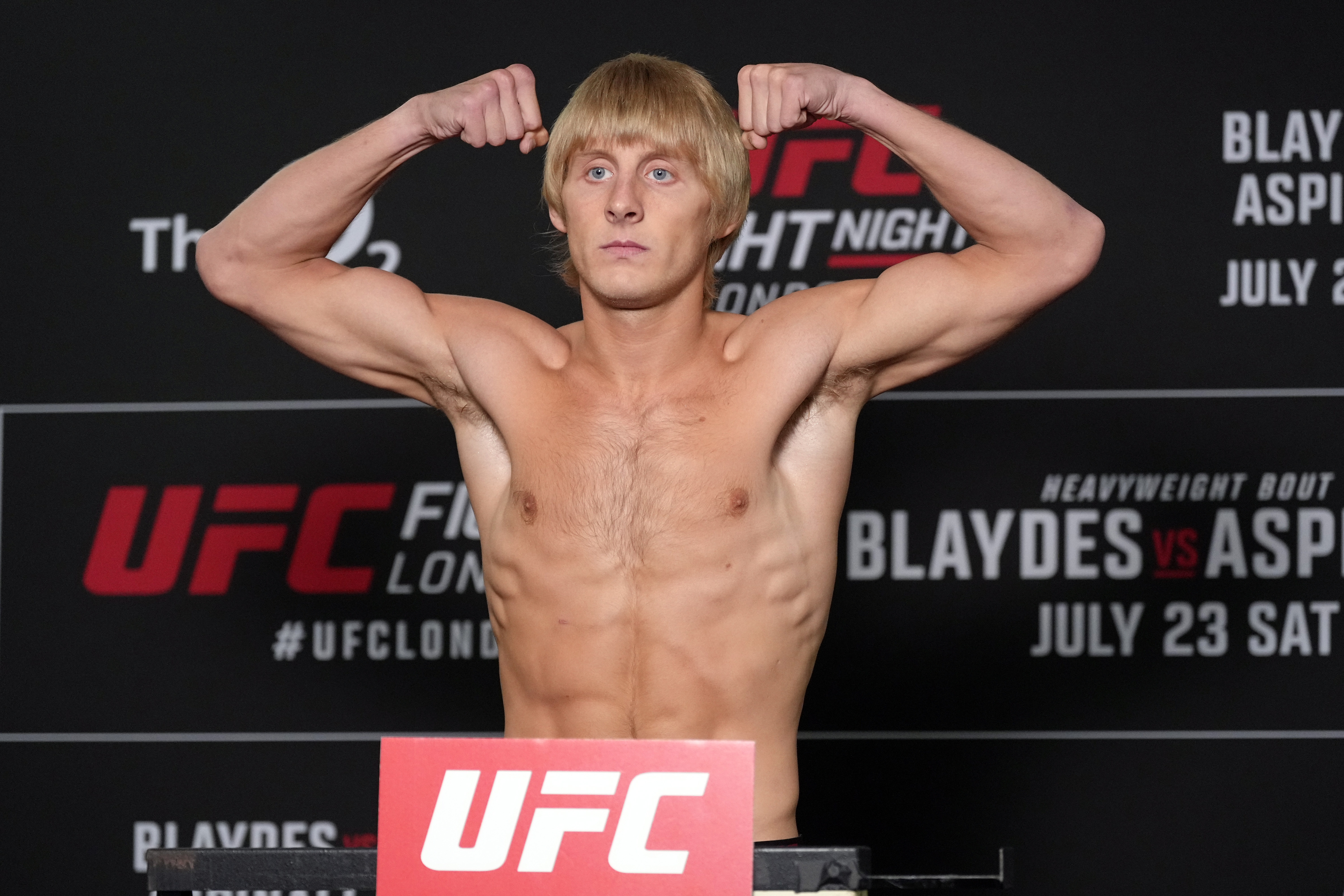Paddy Pimblett flexed on the scale during the UFC Fight Night official weigh-in at the Hilton hotel in London, England, on July 22, 2022. The lightweight had successfully cut down to 155 pounds despite weighing more than 190 pounds in the weeks before his fight against Jordan Leavitt, highlighting the dramatic weight changes that would attract even more attention after the bout.
