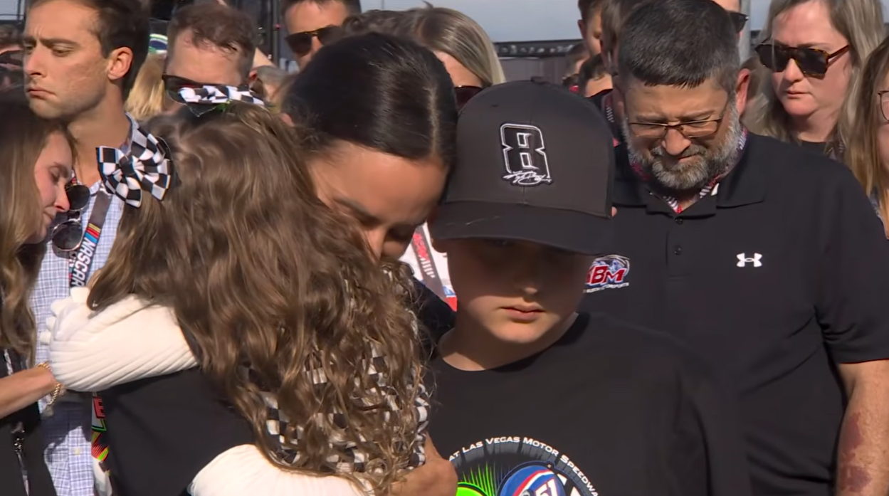 Samantha Busch holds her children close during a tribute ceremony for Kyle Busch before the Coca-Cola 600 on May 24, 2026 | Source: YouTube/NASCAR