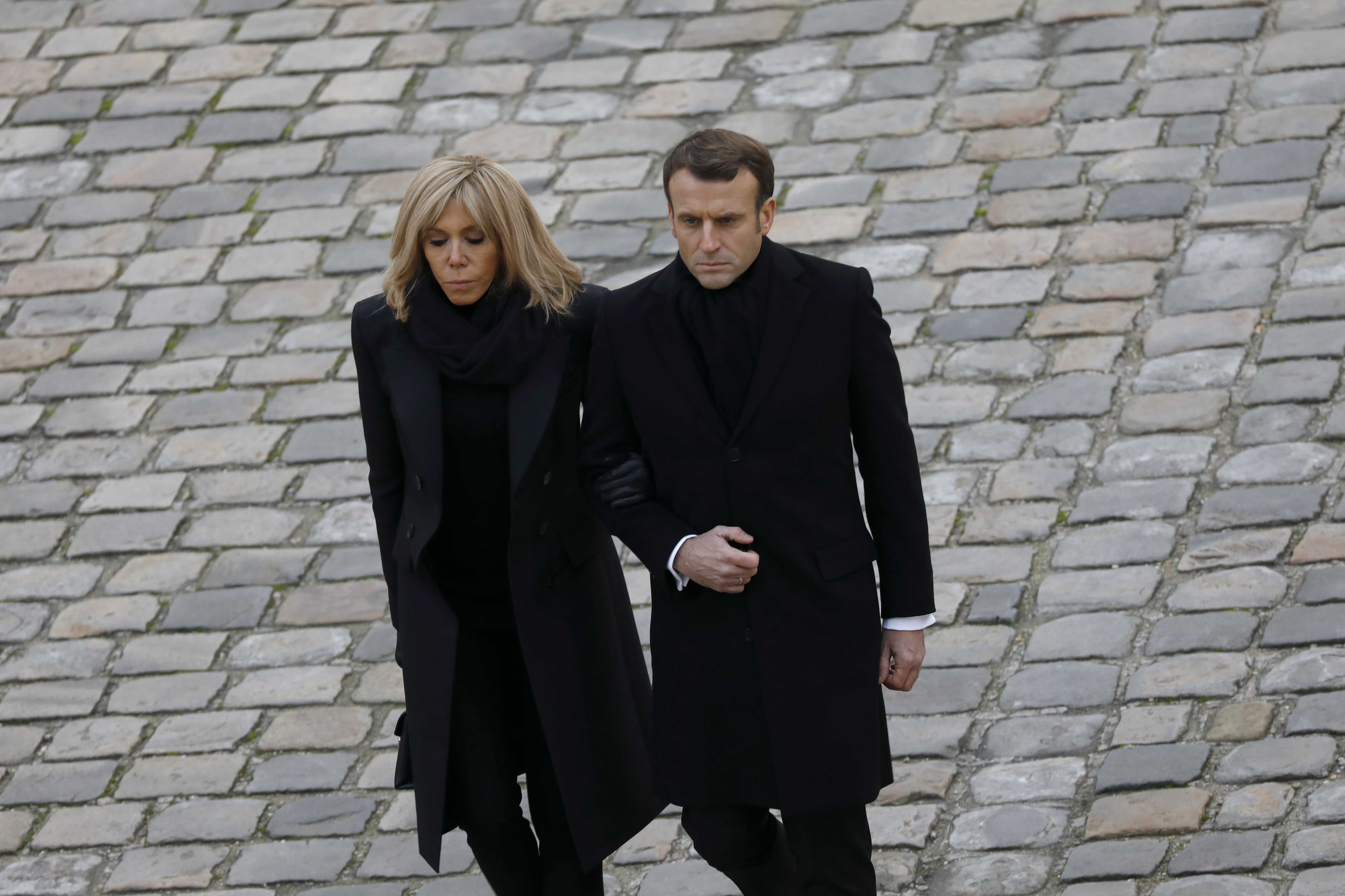 Brigitte and Emmanuel Macron leaving a national tribute ceremony to French soldiers killed in Mali in Paris, France on December 2, 2019. | Source: Getty Images