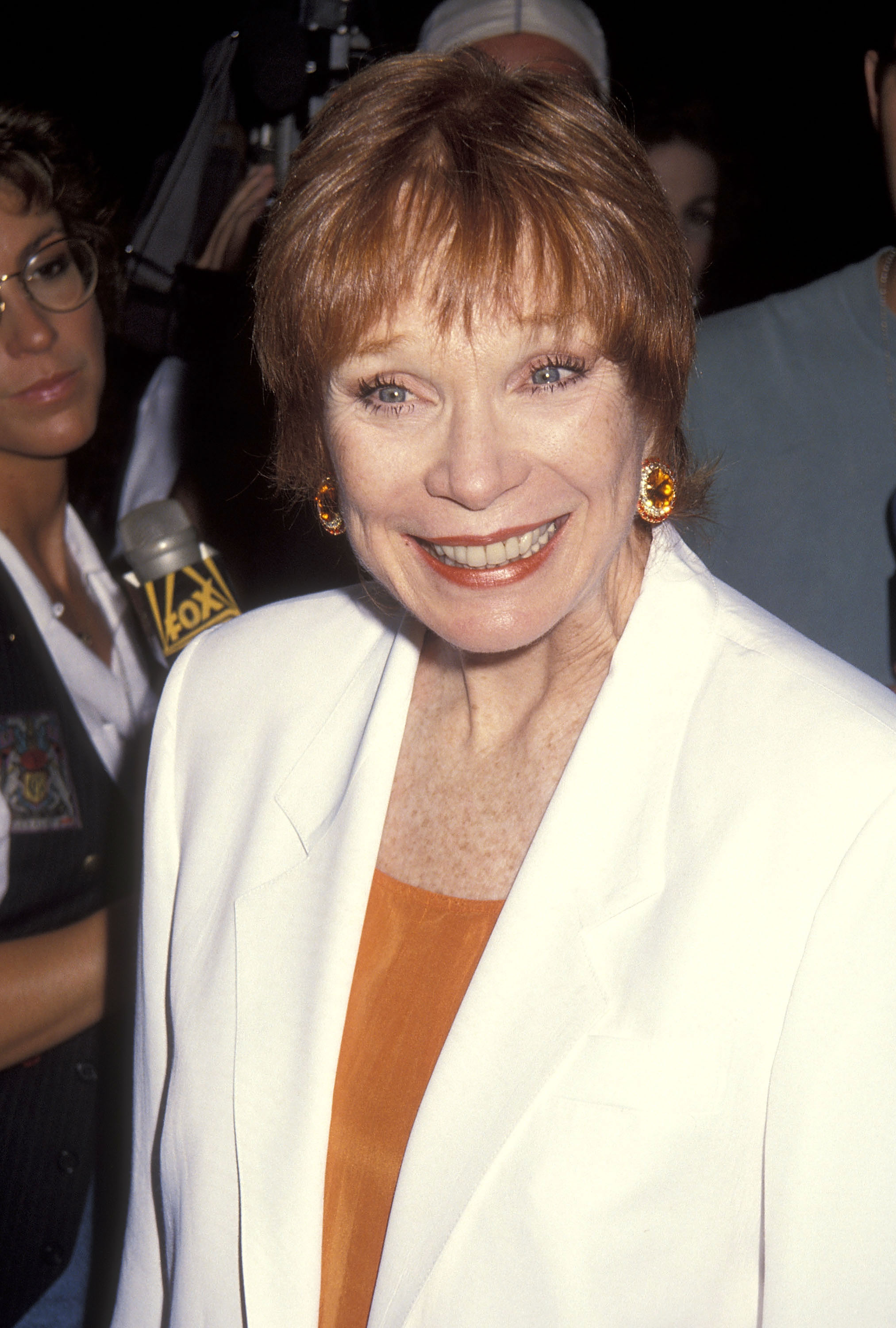 Shirley MacLaine attends a Beverly Hills premiere, smiling toward photographers in a candid red carpet moment | Source: Getty Images
