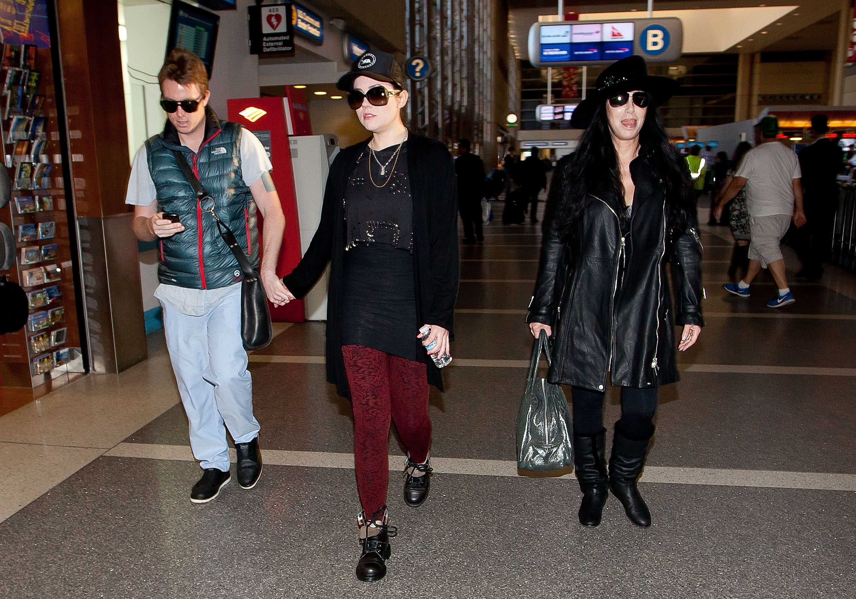 Elijah Blue Allman is seen with an unnamed woman and Cher on December 10, 2012, in Los Angeles, California | Source: Getty Images