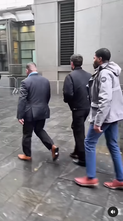 Alex Fine walks with security outside the courthouse following her testimony in the Sean "Diddy" Combs trial | Source: Instagram/people