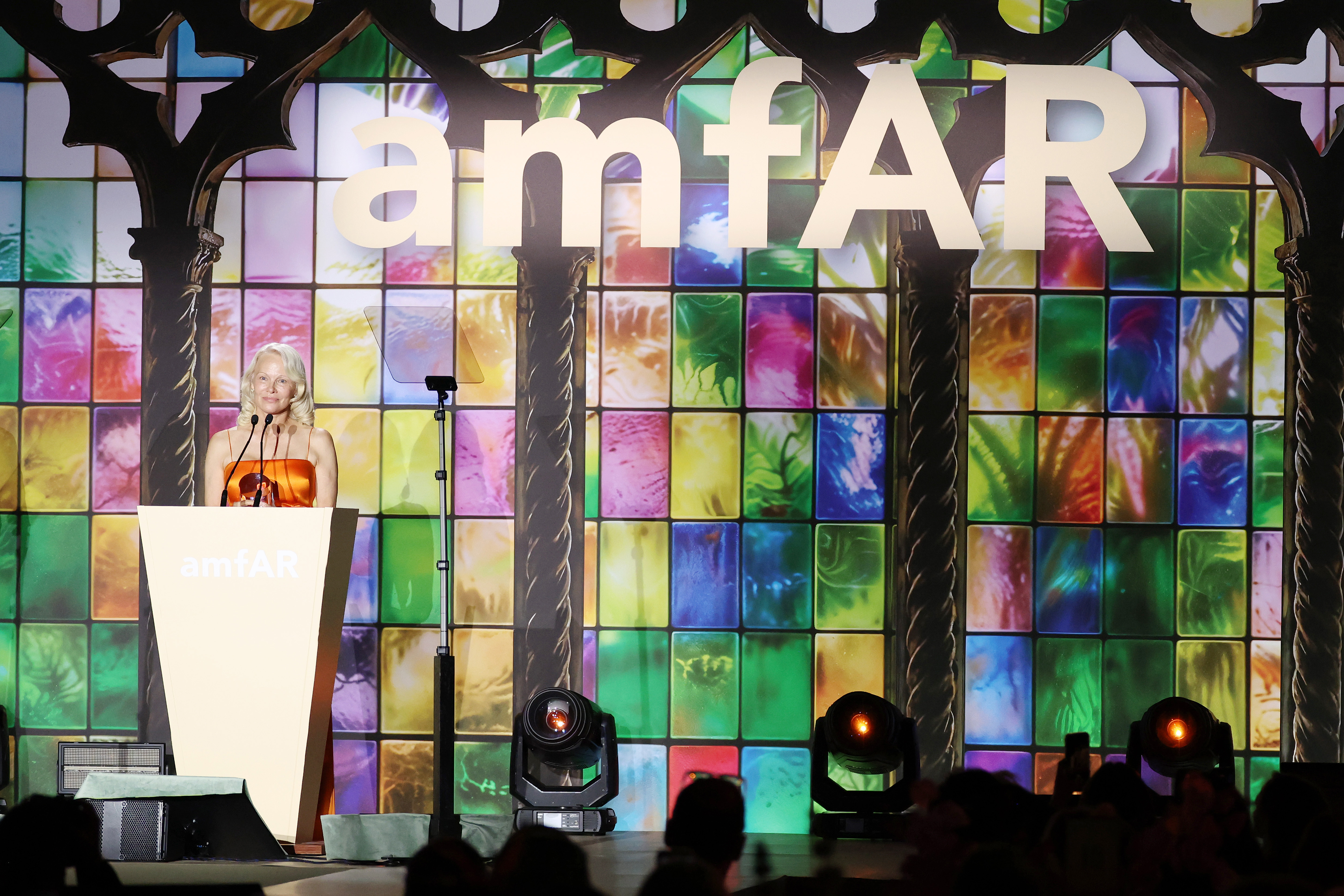 Anderson addressed guests after accepting the Award of Courage at amfAR Gala Venezia 2026. Her remarks moved beyond the celebration as she reflected on experiences whose emotional effects had remained with her for years. | Source: Getty Images