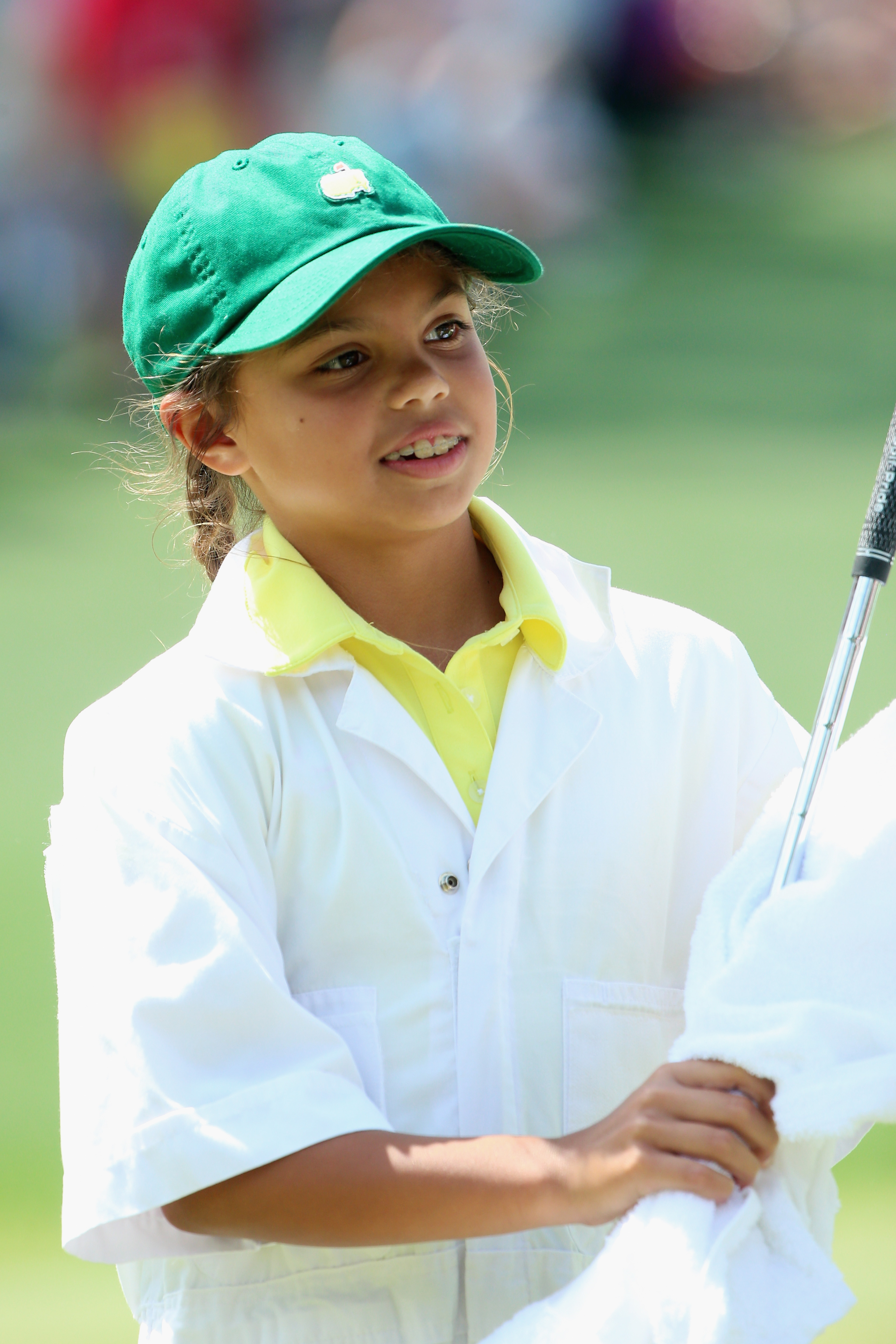 Sam Woods works as a caddie for Tiger Woods during the Par 3 Contest prior to the start of the Masters Tournament at Augusta National Golf Club on April 8, 2015, in Augusta, Georgia | Source: Getty Images