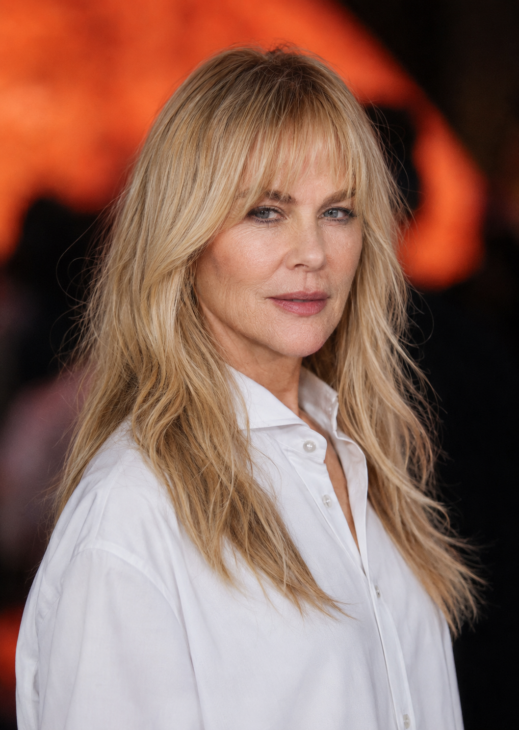 Shifting to the longer blonde hair and wispy fringe of her later eras, this look retains a completely natural skin texture, proving that a modern, stylish look can coexist with realistic creases around the mouth and eyes. | Source: Midjourney