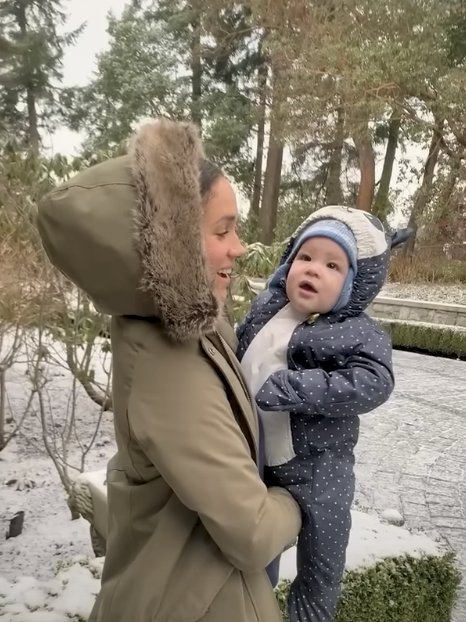 Meghan Markle pictured holding Prince Archie | Source: YouTube/LMT
