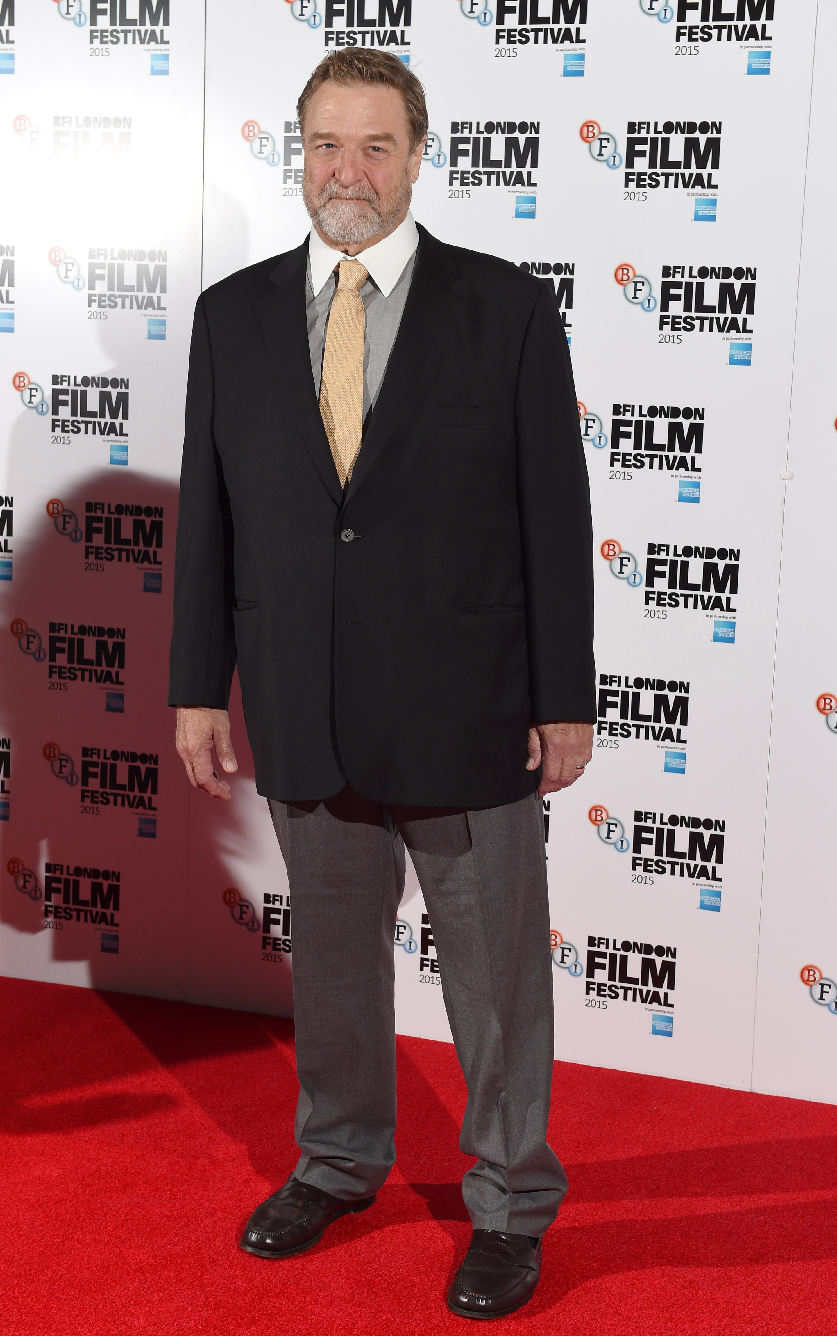 John Goodman steps out for a "Trumbo" photocall during the BFI London Film Festival on October 8, 2015, showing the continued results of his long-term lifestyle changes. | Source: Getty Images
