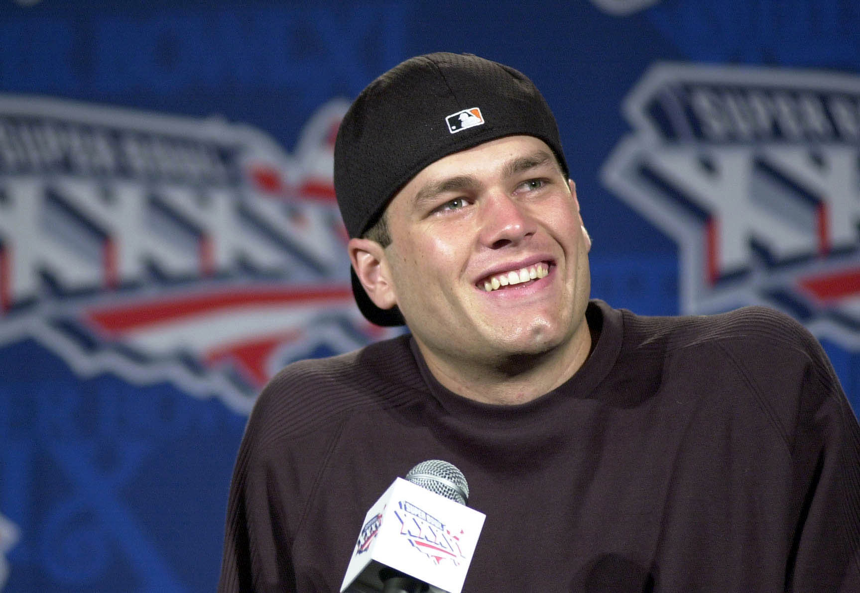 Tom Brady smiled during a 2001 press conference after being named the New England Patriots' starting quarterback ahead of Super Bowl XXXVI.