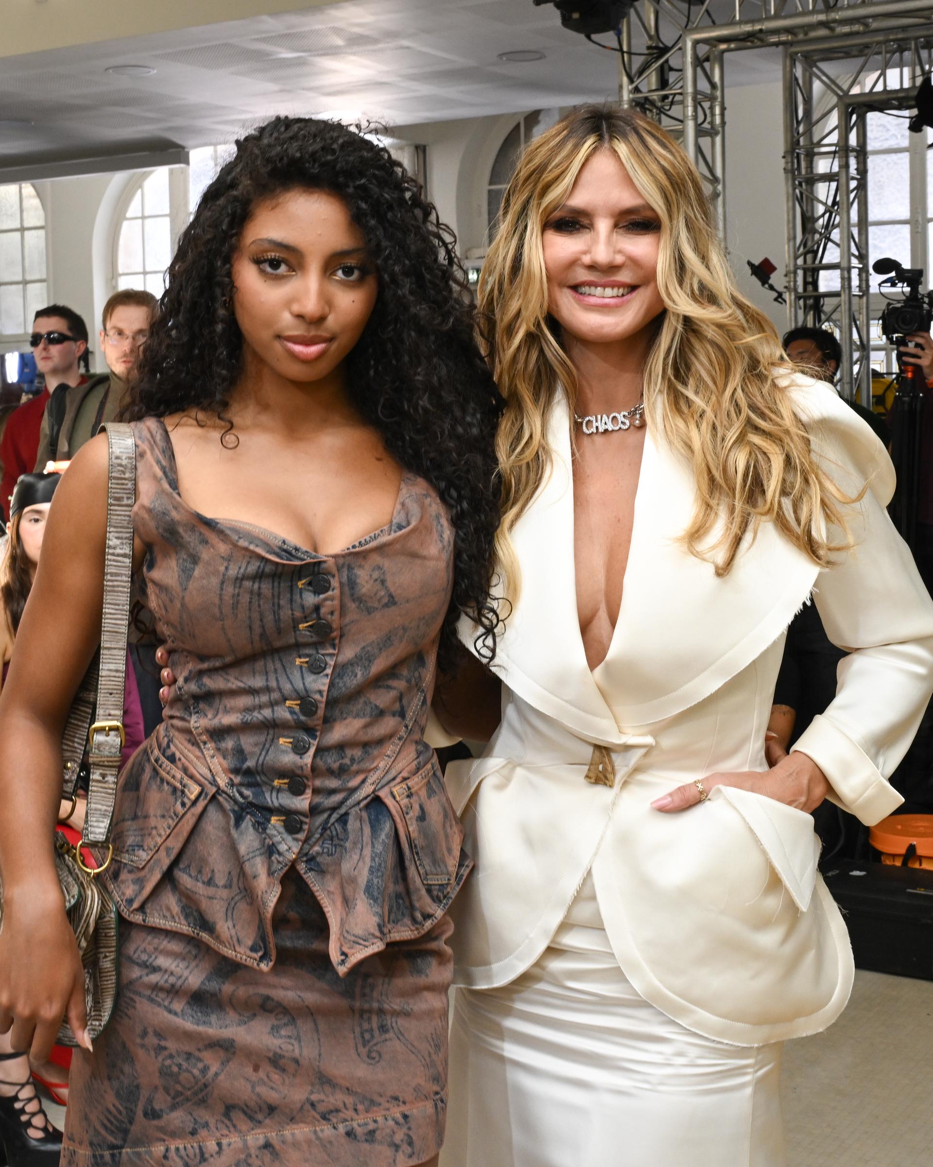 Near the end of Lou’s first Paris Fashion Week, mother and daughter were still posing side by side — but Lou no longer looked like the child being introduced to Heidi’s world. She looked increasingly comfortable occupying her own place in it. | Source: Getty Images