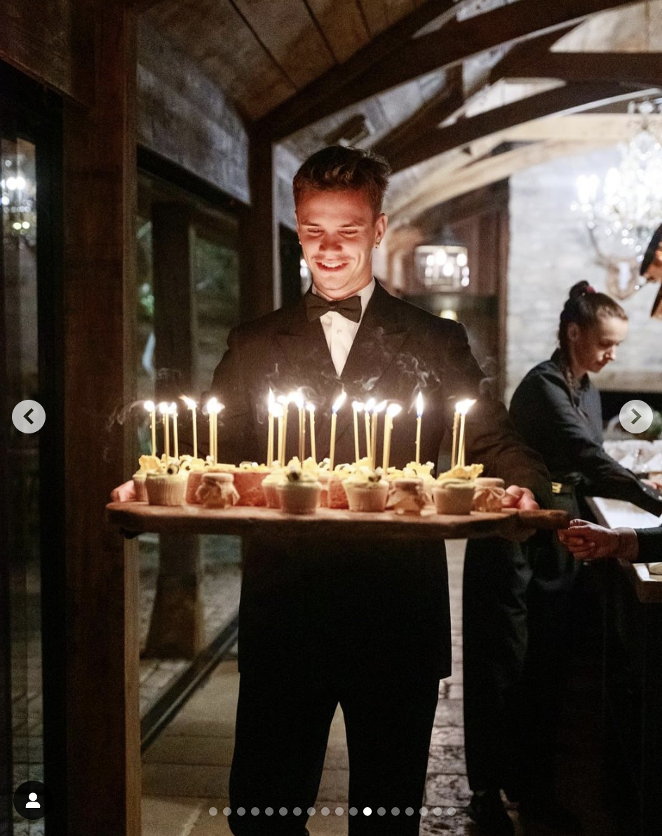 Romeo Beckham holding a tray of cupcakes on his father's 50th birthday celebration, as seen in a photo dated May 4, 2025 | Source: Instagram/victoriabeckham