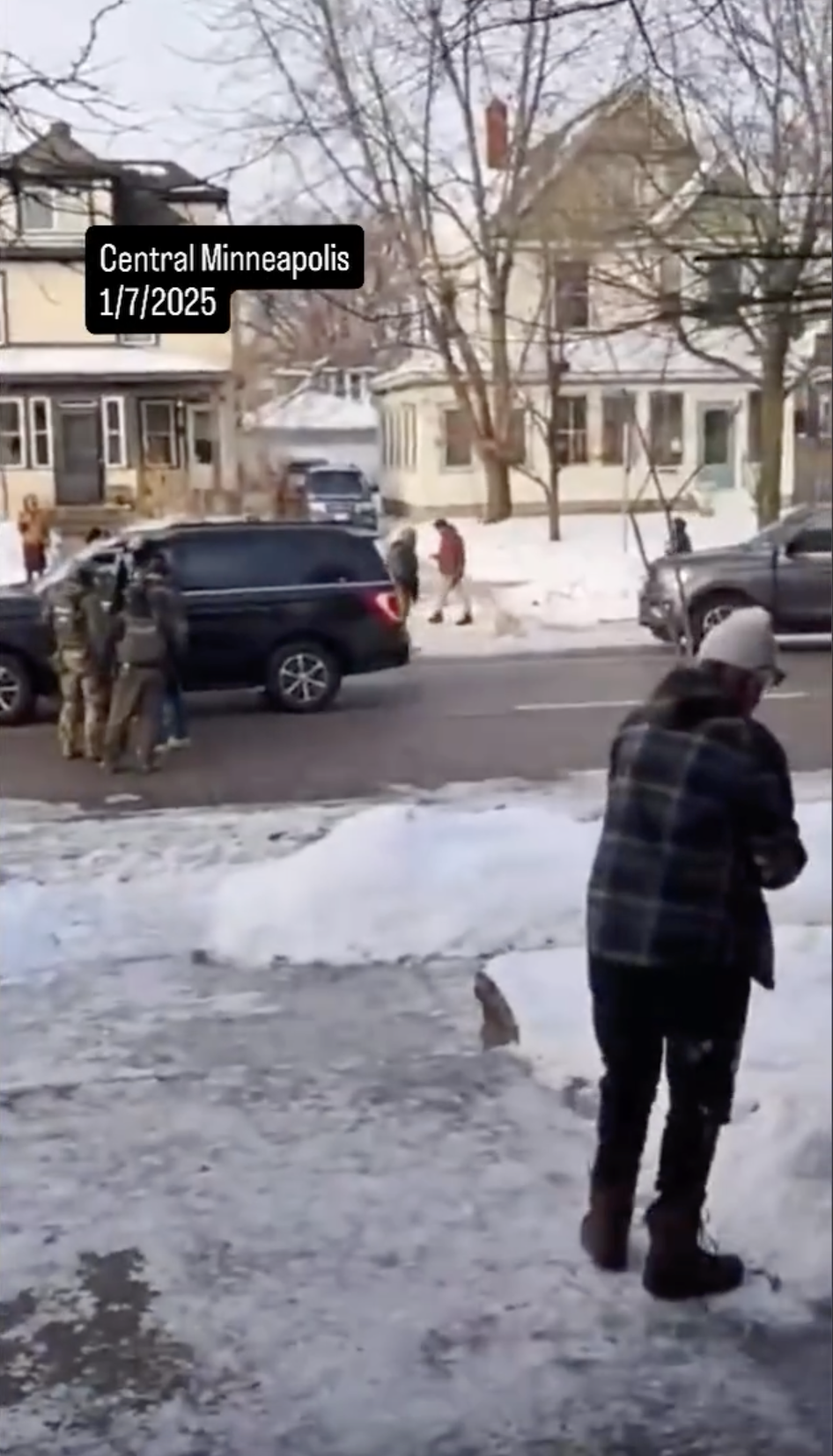 People gathered near Renee Nicole Good's car crash site after she was shot by an ICE agent on January 7, 2026 | Source: Instagram/migrantinsider