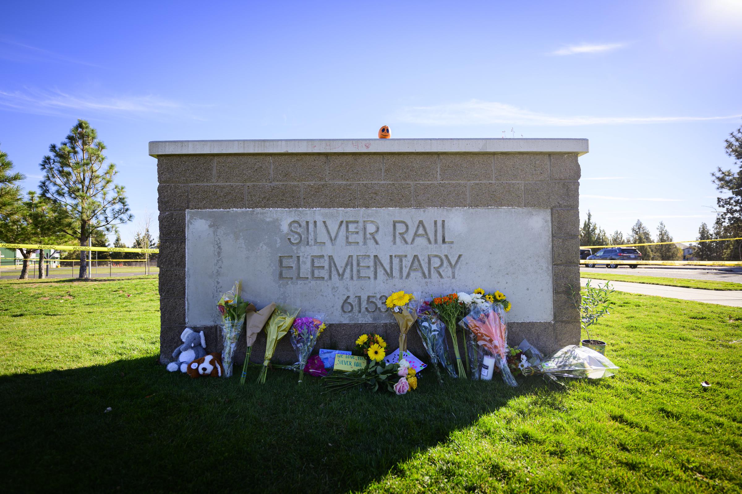 Flowers, candles, handwritten notes and stuffed animals continued to gather outside Silver Rail as families and neighbors mourned the four victims. | Source: Getty Images